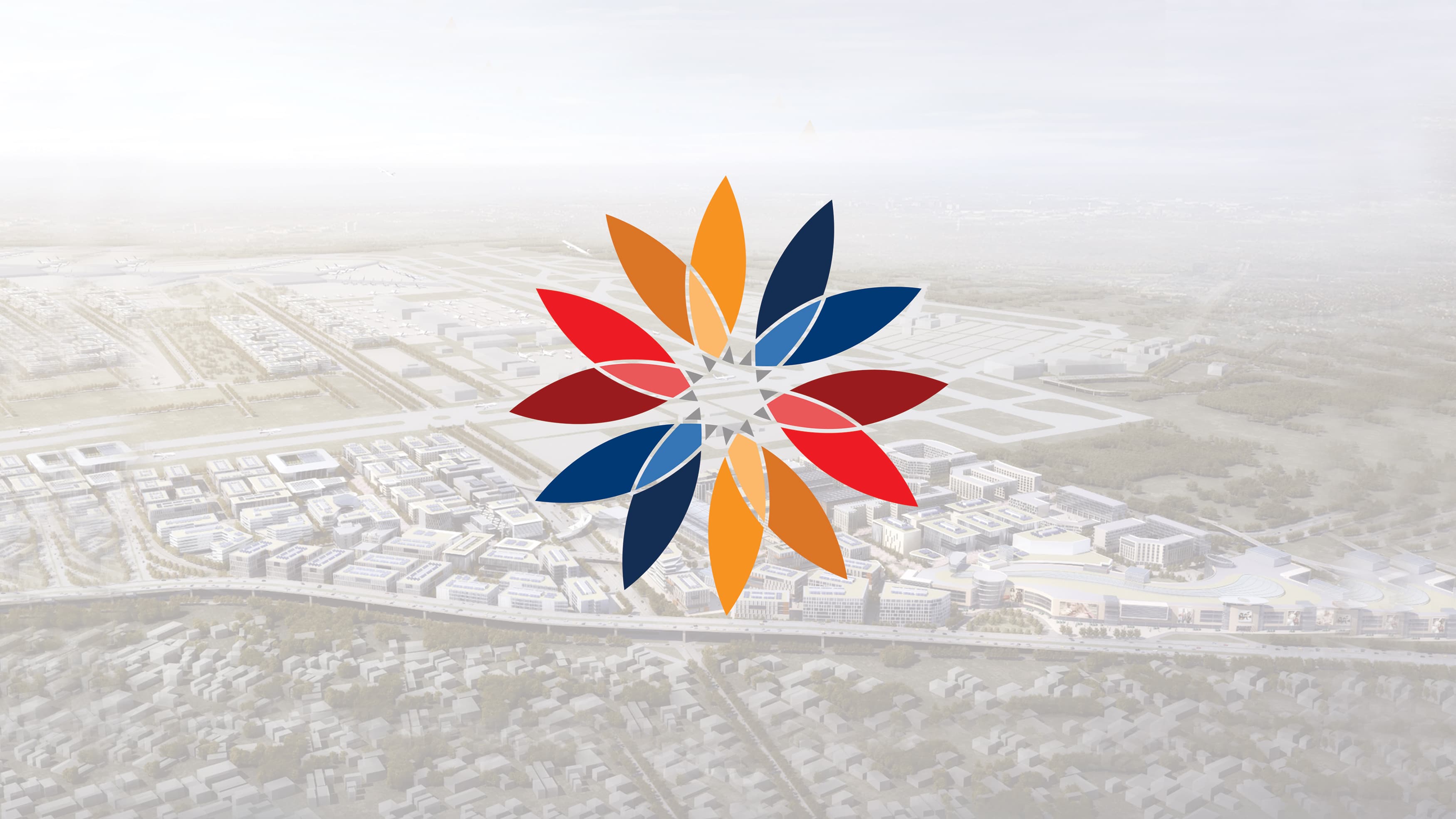 Circular kaleidoscope like logo placed on an aerial image of a city.