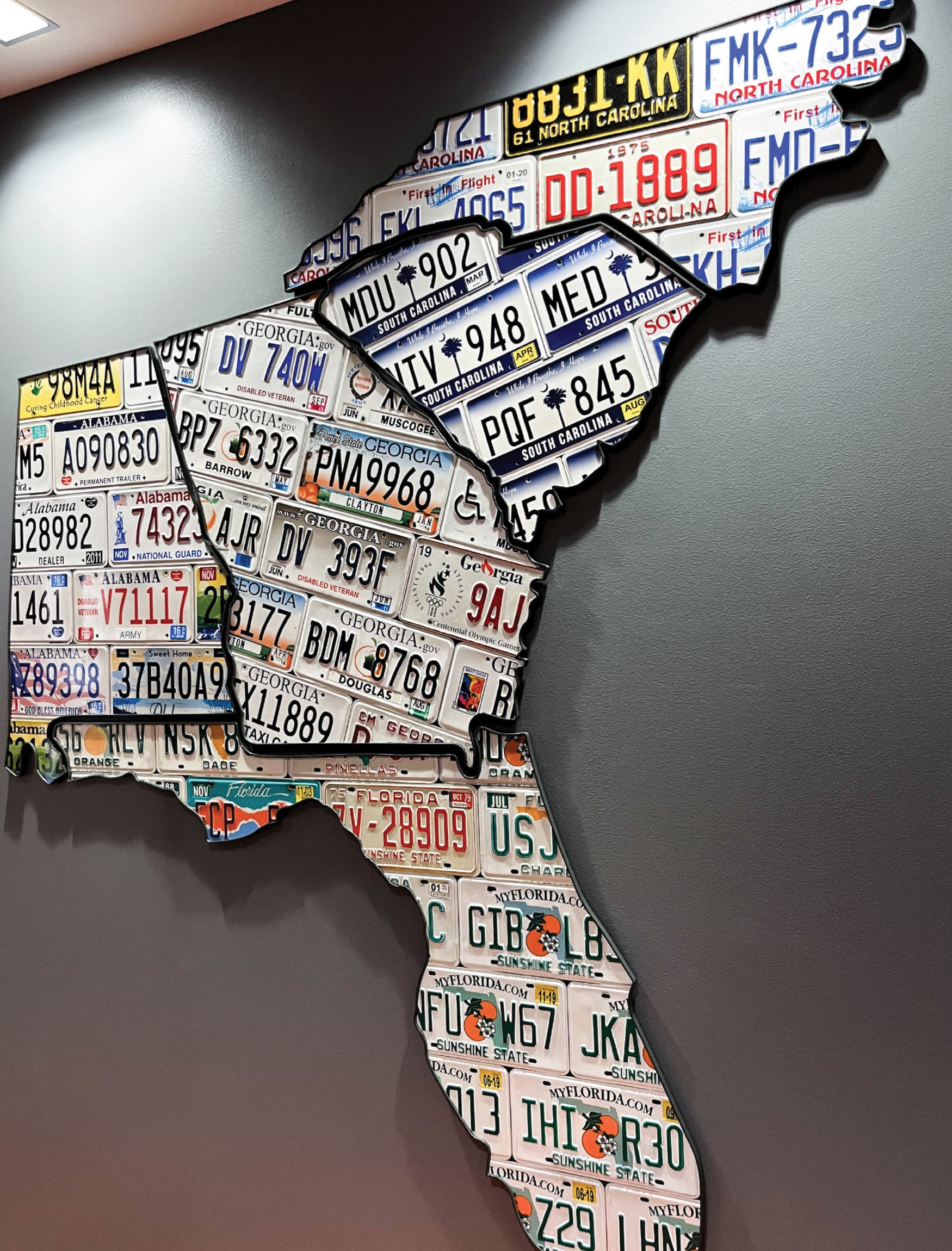 Specialty graphic of the shape of the state of Florida, created out of license plate frames for JM Family Headquarters. 