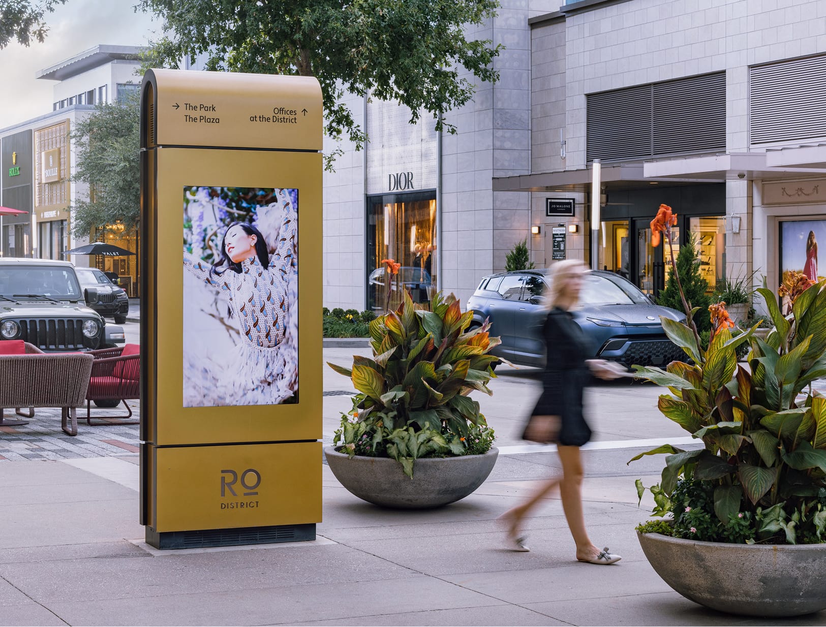 River Oaks District Houston digital directional kiosk with fashion imagery near Dior storefront, wayfinding design by RSM Design