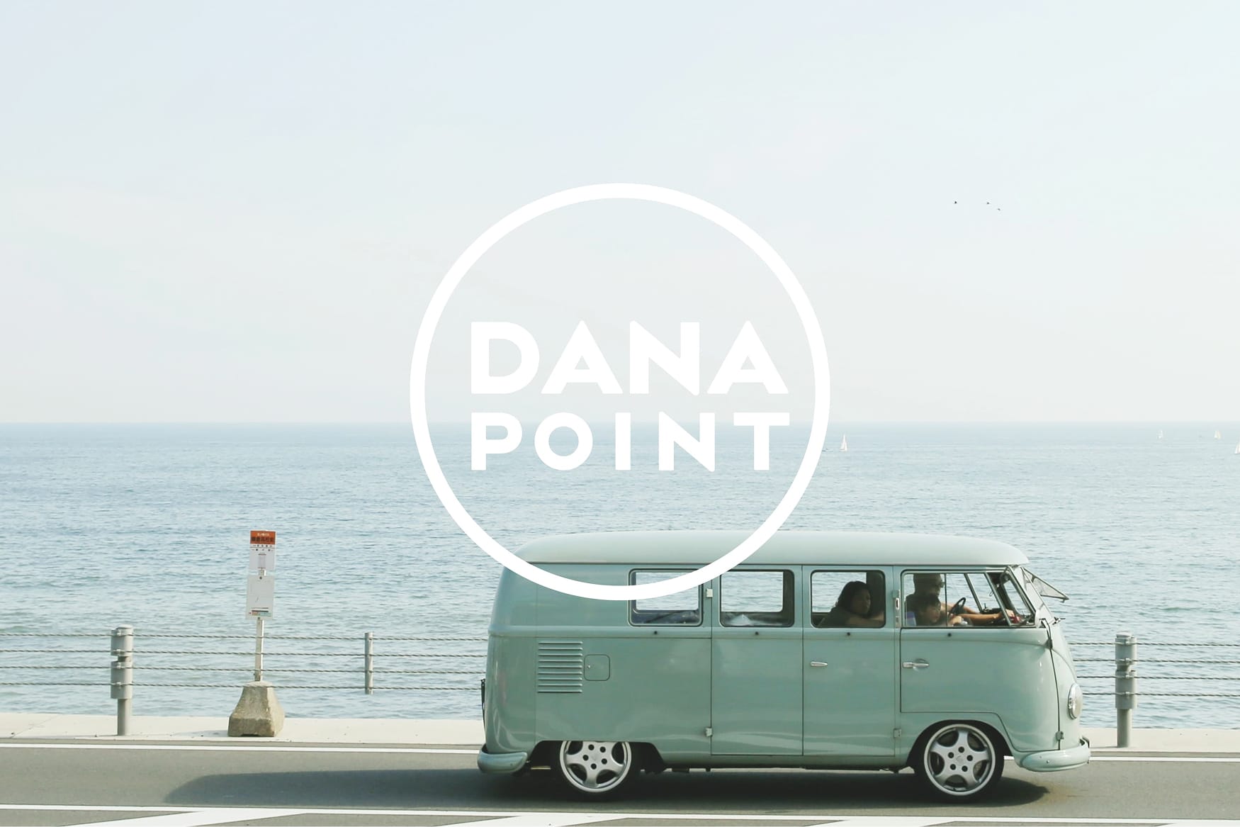 "Dana Point" circular logo mark over an oceanfront road with a vintage VW bus, brand identity by RSM Design