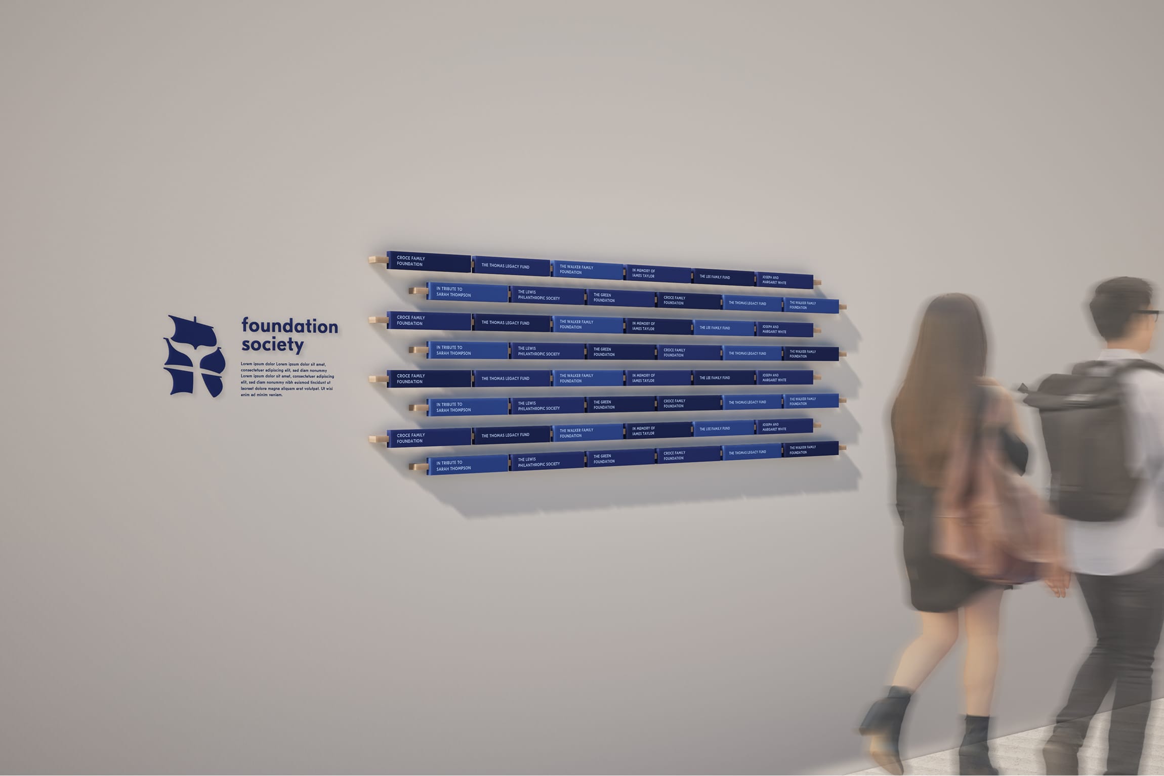 Horizontal donor recognition wall with sail-shaped icon reading "Foundation Society," featuring rows of blue name plaques on wood dowels, donor wall signage by RSM Design
