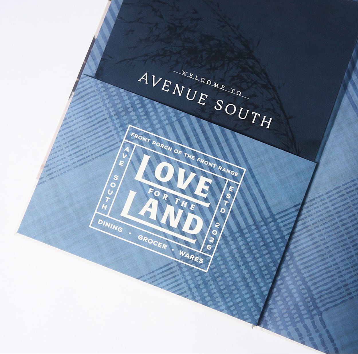 "Welcome to Avenue South" cover page beside "Love for the Land" badge lockup on indigo textile pattern, brand identity print collateral by RSM Design.