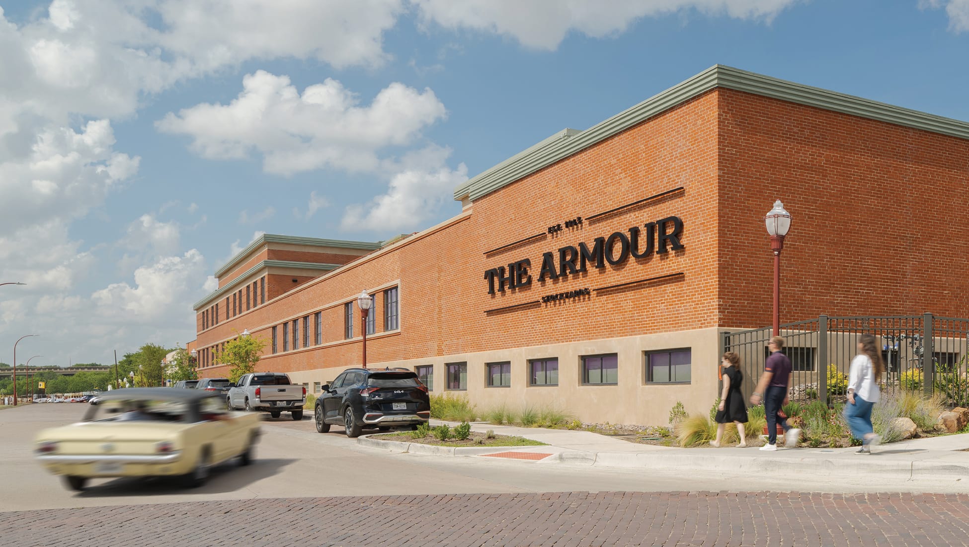 The Armour Stockyards brick building exterior with dimensional wall signage, environmental graphic design by RSM Design