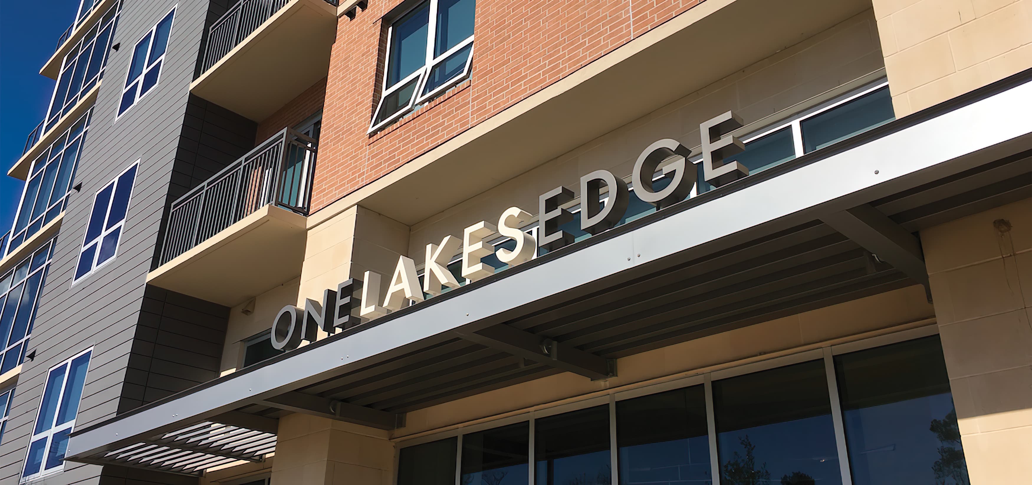 Hughes Landing, a mixed-use development in  The Woodlands, Texas. Building Signage. Project Signage. Canopy Signage.