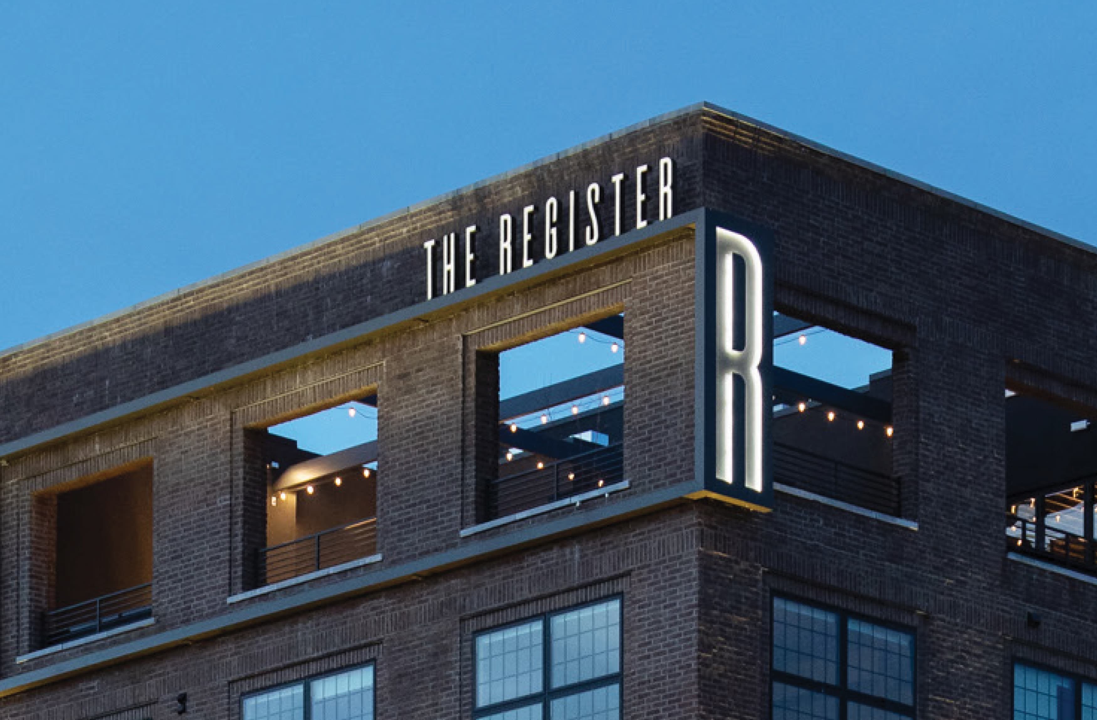 Close up image of the Register building identity signage at Post District in Utah. 