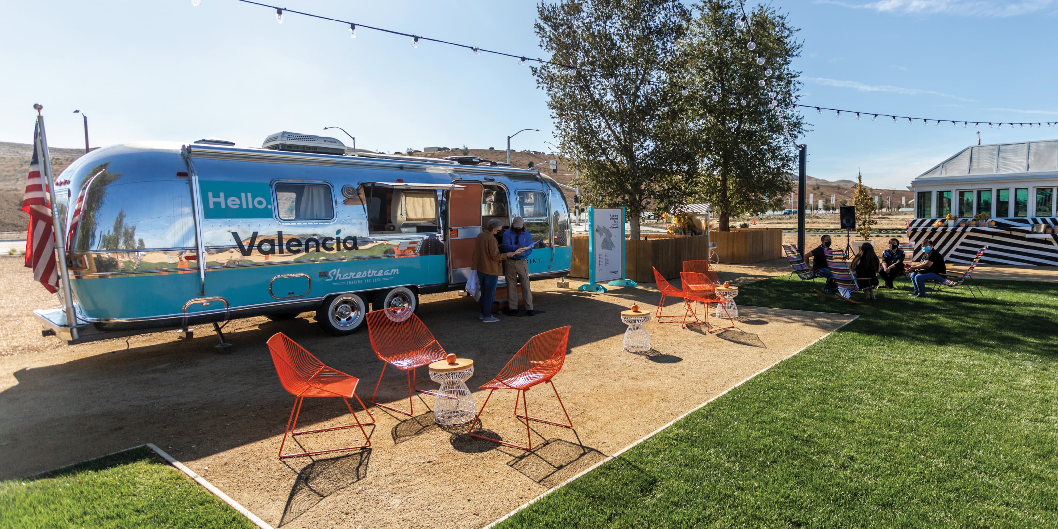 Image of the Valencia Sharestream, an airstream converted into a community hub that host events and hold marketing materials. Airstream designed by RSM Design. 