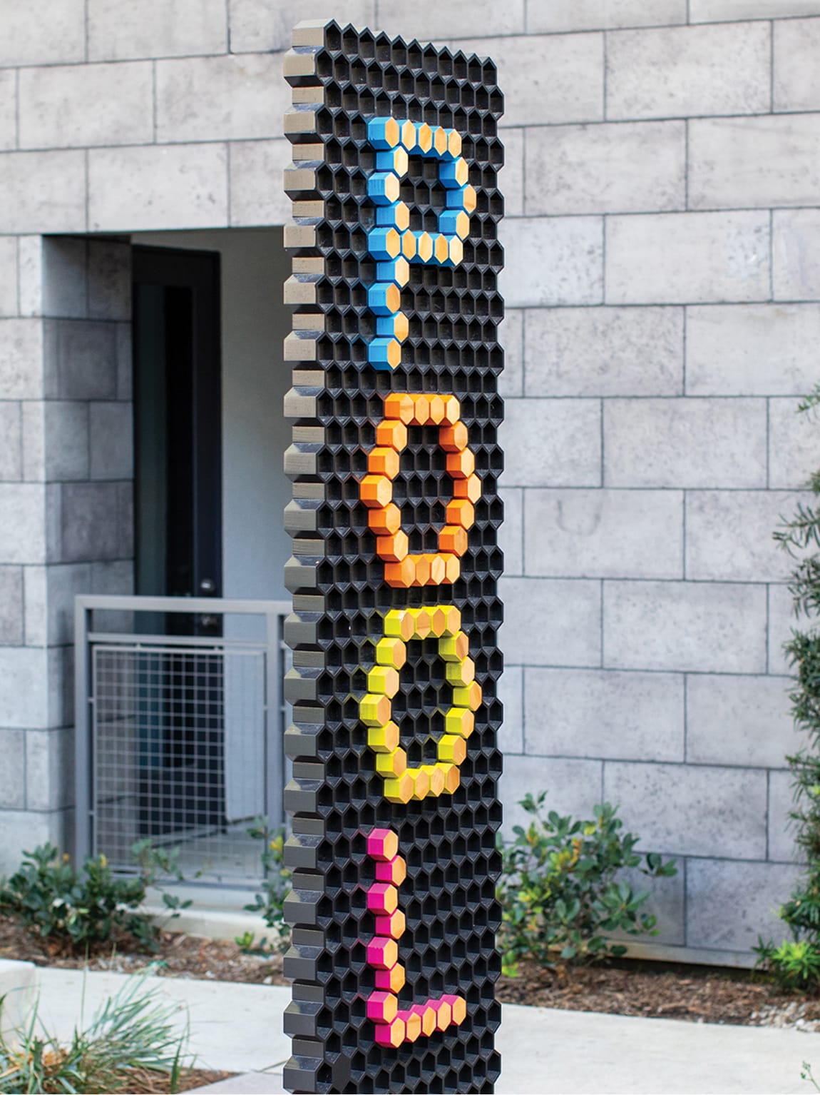 Persea residential community sculptural Pool sign with colorful hexagonal peg letters, environmental graphic design by RSM Design