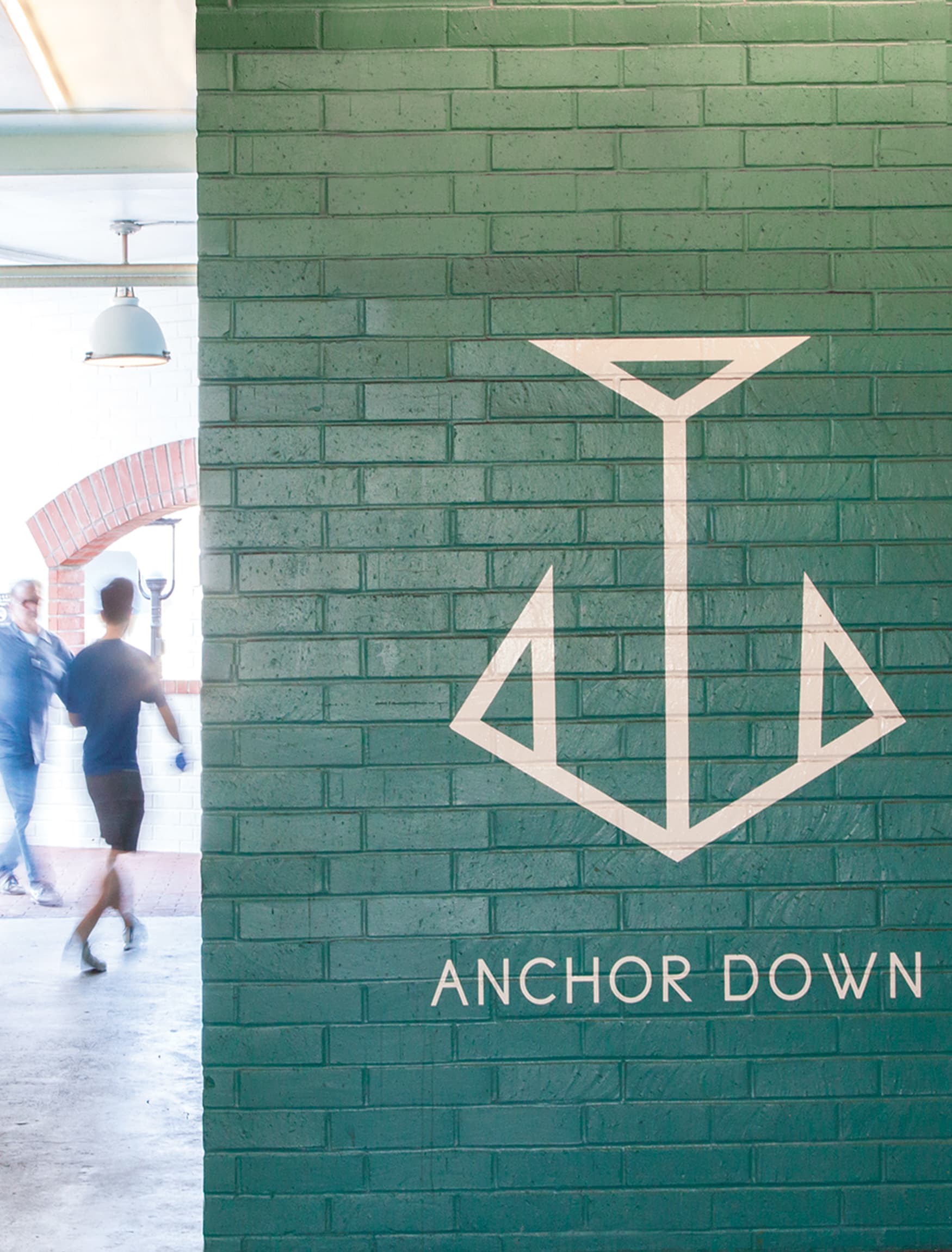 Image of the painted wayfinding iconography in the parking garage of Lido Marina Village in Newport Beach, CA. 