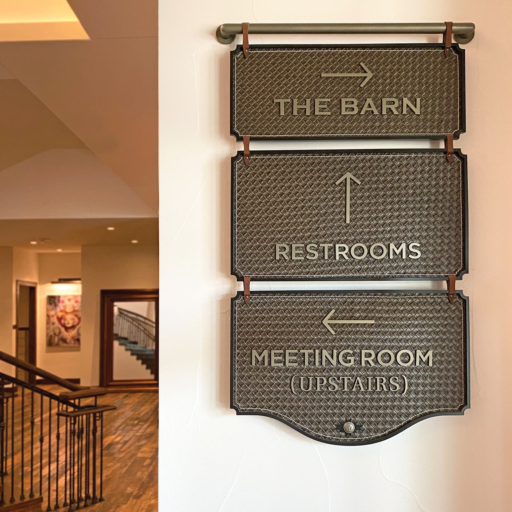 Interior hotel directional signage for The Drover Hotel in Fort Worth, Texas.