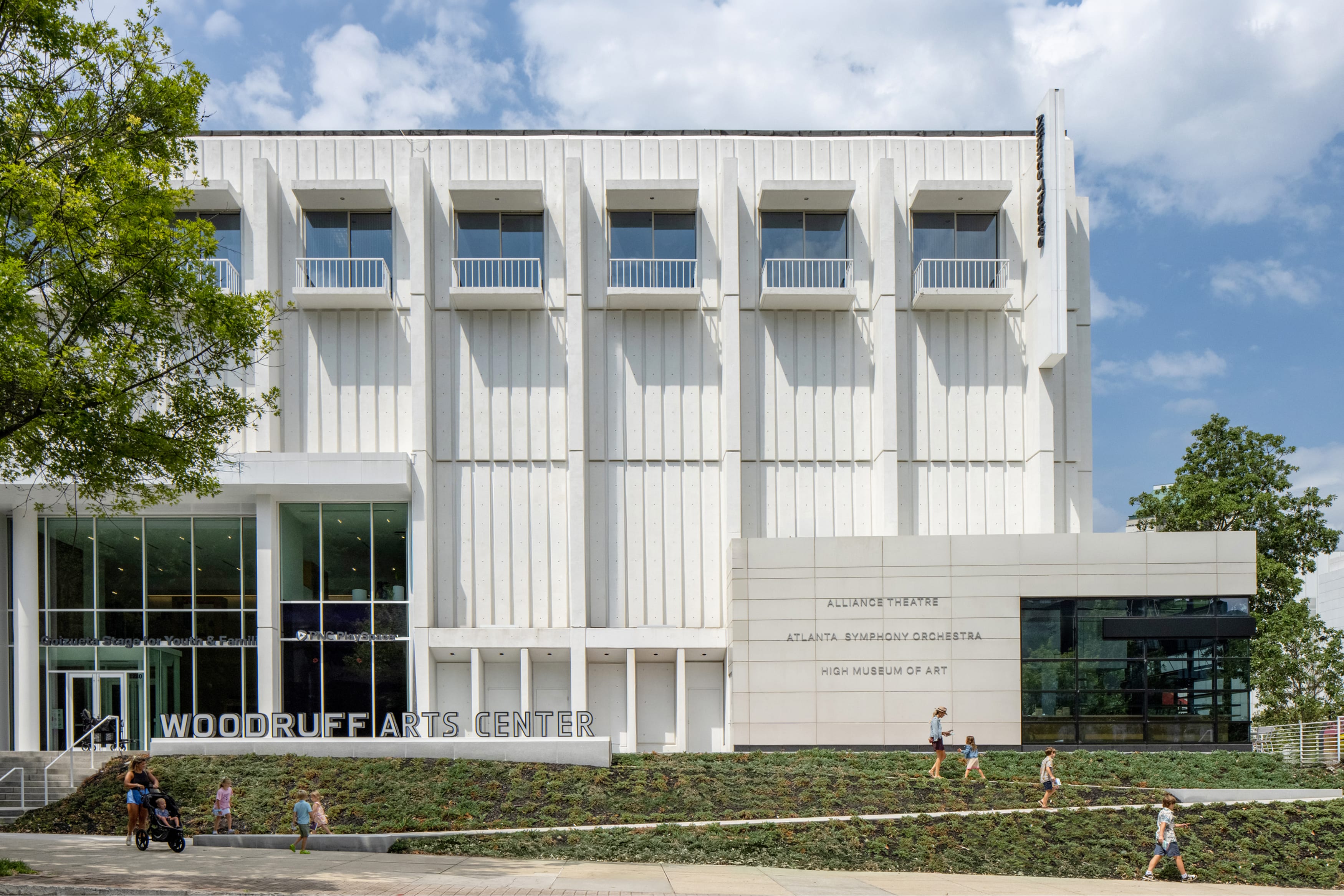 Woodruff Arts Center building identification sign and wall-mounted directory listing the Alliance Theatre, Atlanta Symphony Orchestra, and High Museum of Art in Midtown Atlanta – campus wayfinding and environmental graphic design by RSM Design.