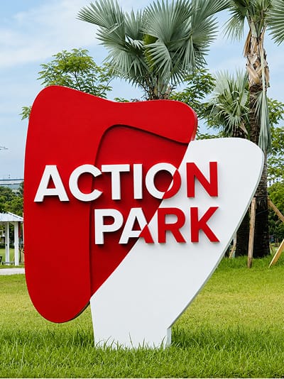 Action Park identity monument sign with bold red and white dimensional form — environmental graphic design by RSM Design