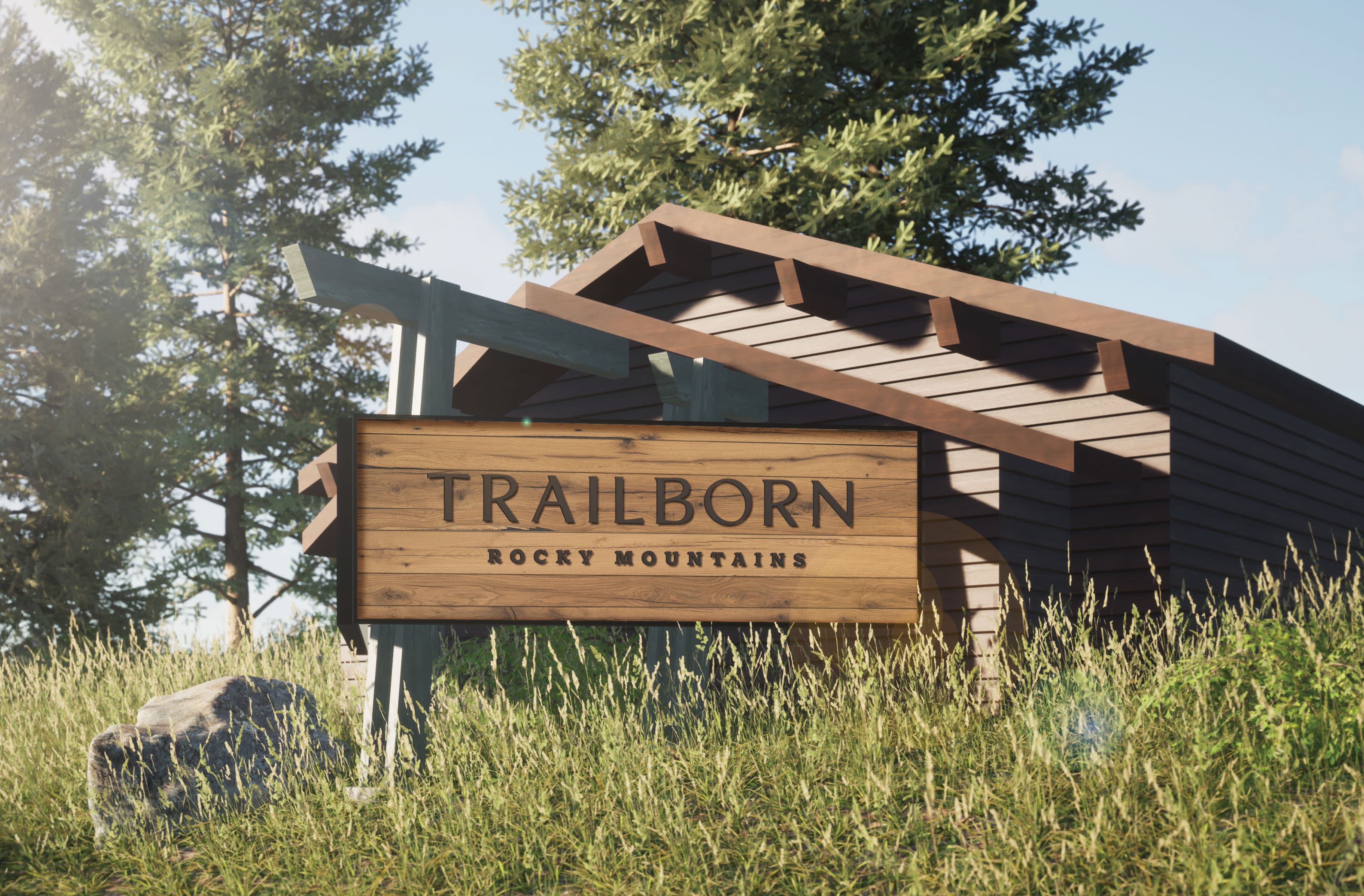 Detail image of the Trailborn Rocky Mountains hotel directional signage up on the hillside, off the main road. Signage design by RSM Design. 