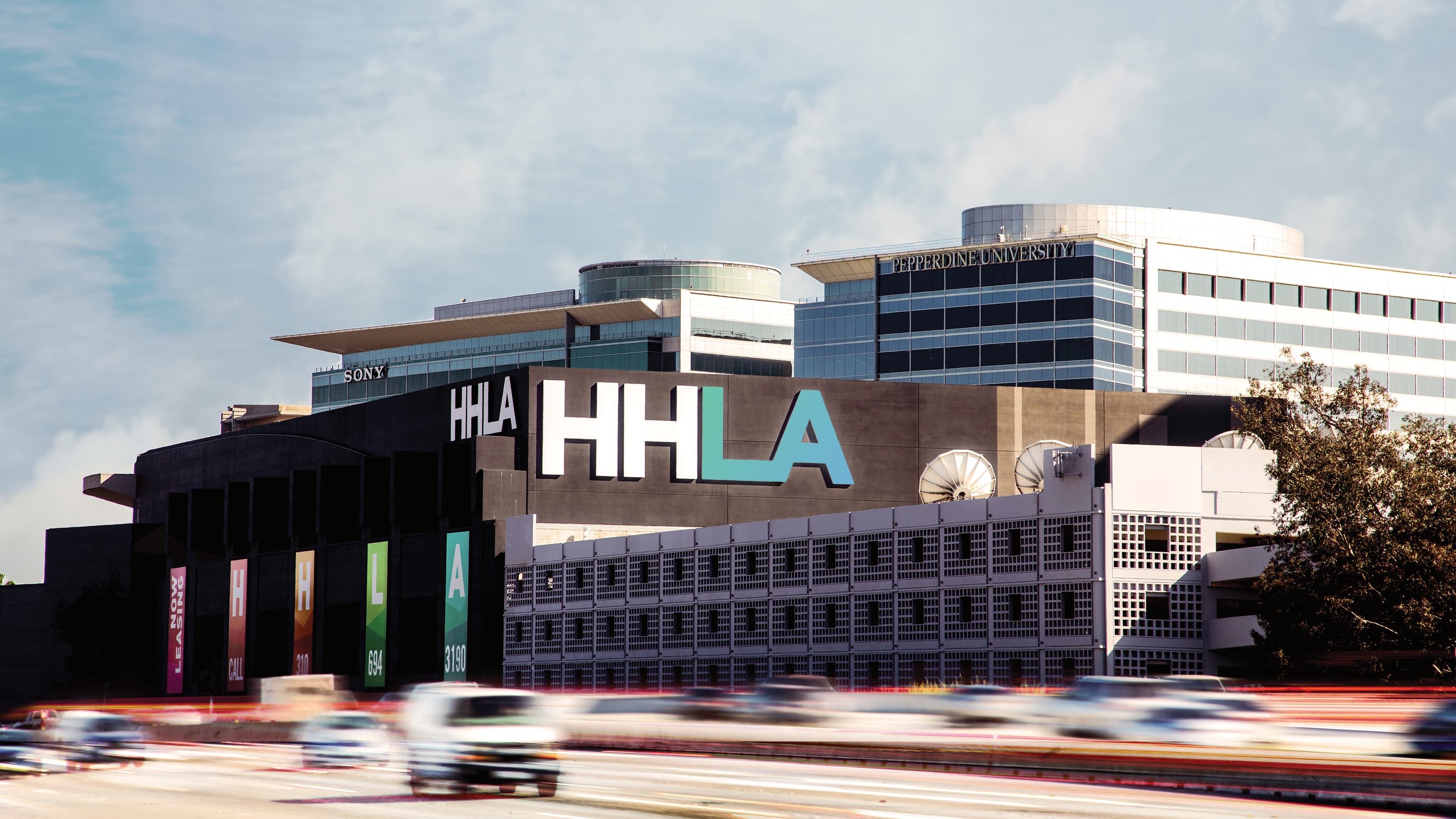 HHLA project from across the 5 freeway, with giant identity facing outward.