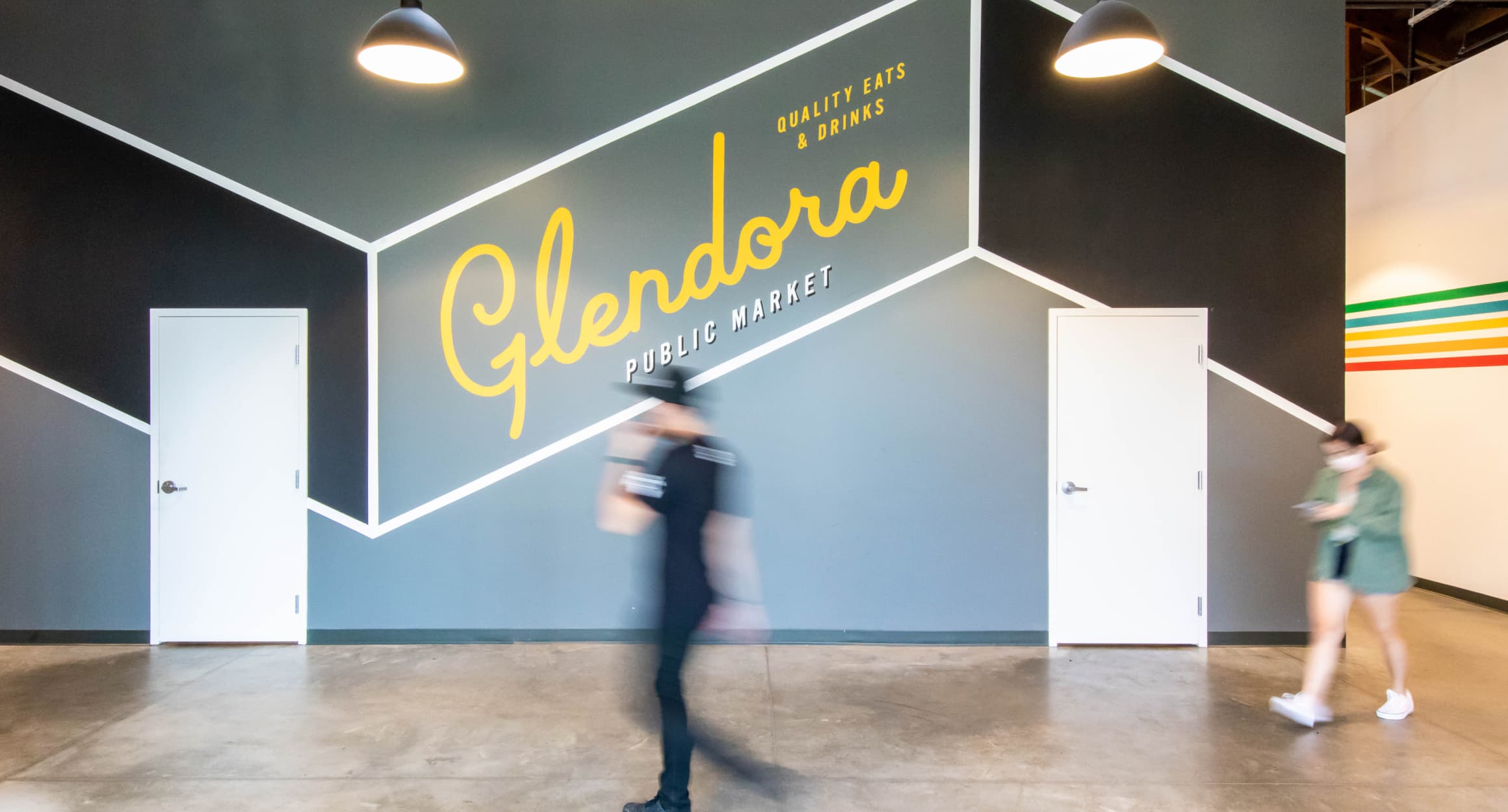 Painted yellow Glendora decorative signage for Glendora Public Market in Glendora, California