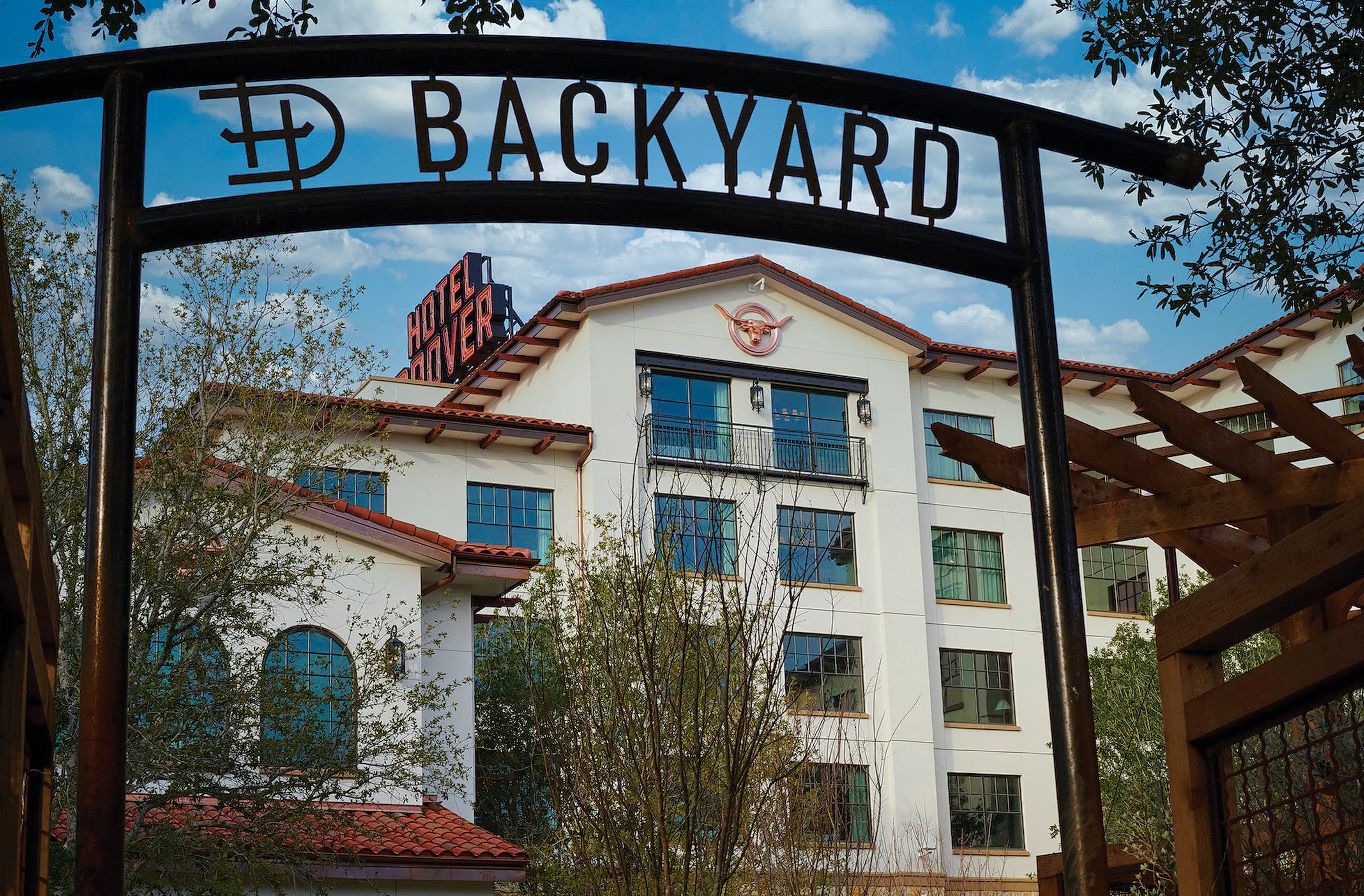 Exterior paseo identity for the "Backyard" for The Drover Hotel in Fort Worth, Texas.