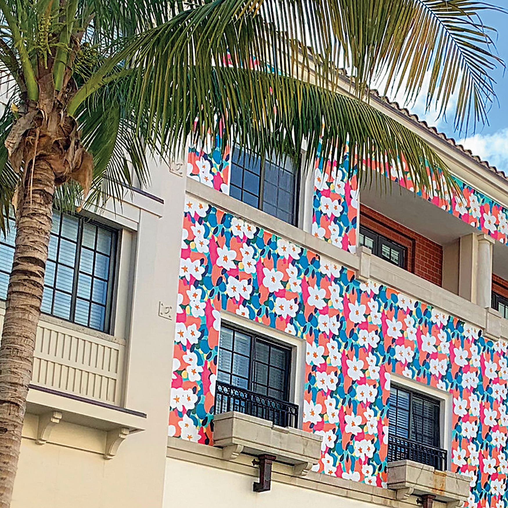 Floral pattern painted on architectural facade of retail center in Florida.