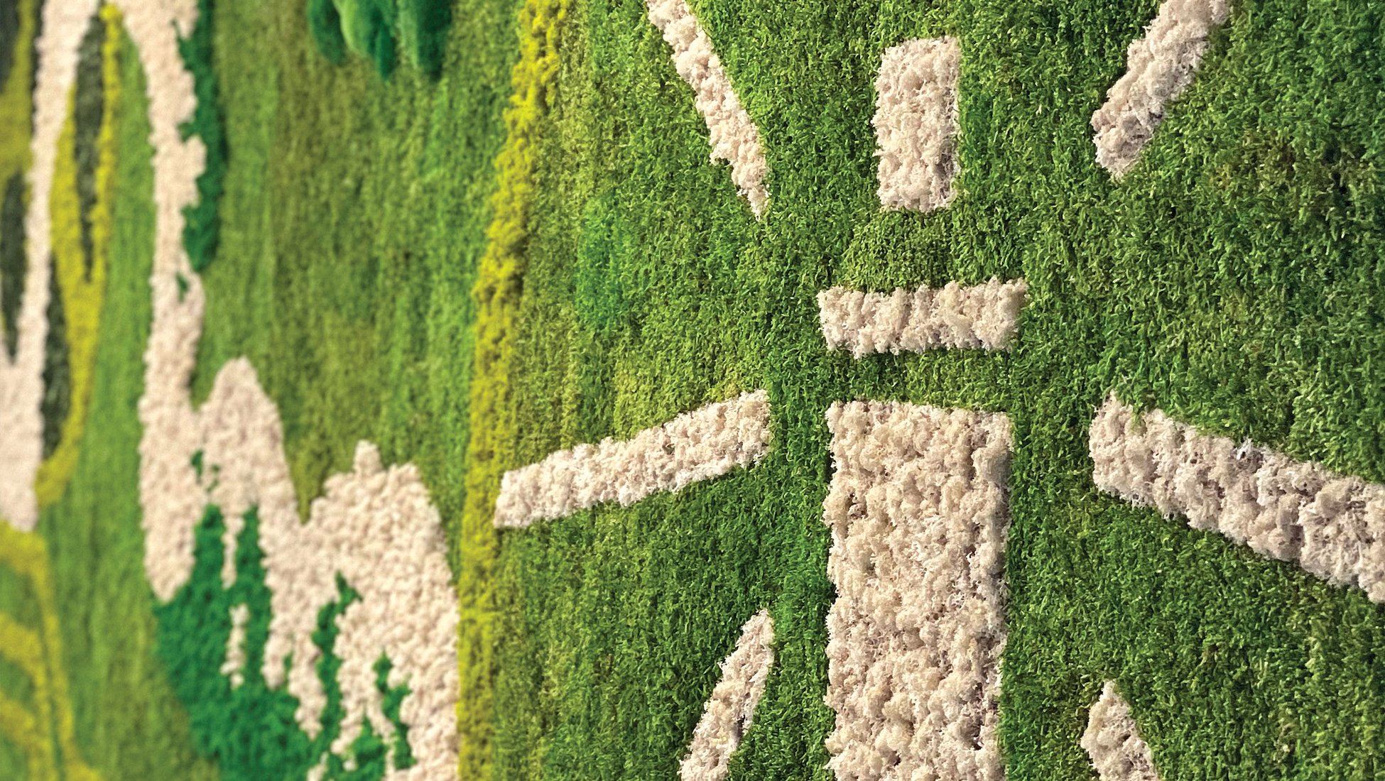 Preserved moss wall art with white and green textured figures, custom biophilic interior design installation by RSM Design