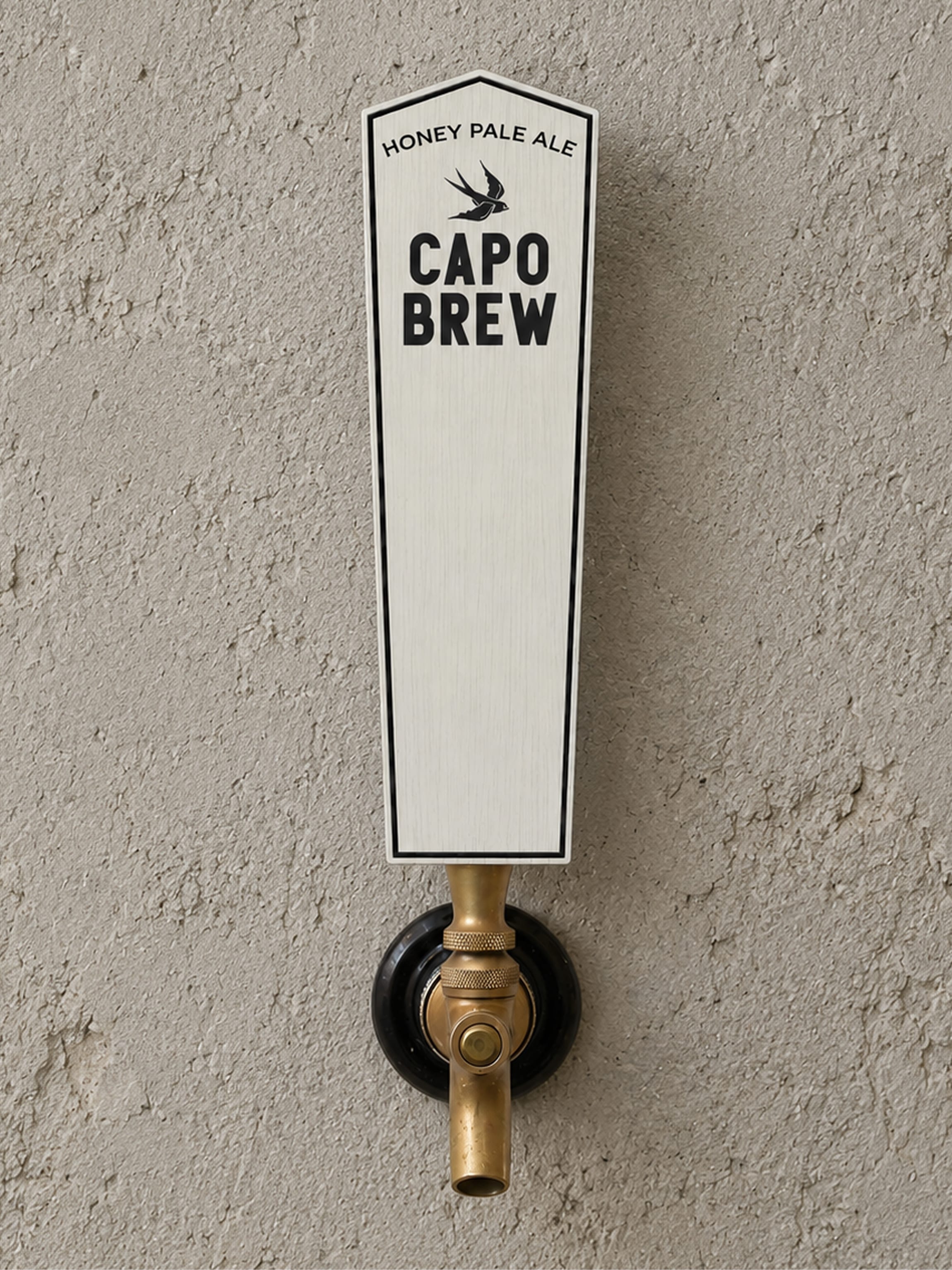Cream Capo Brew tap handle with swallow icon reading "Honey Pale Ale" against a stucco wall, brand identity design by RSM Design