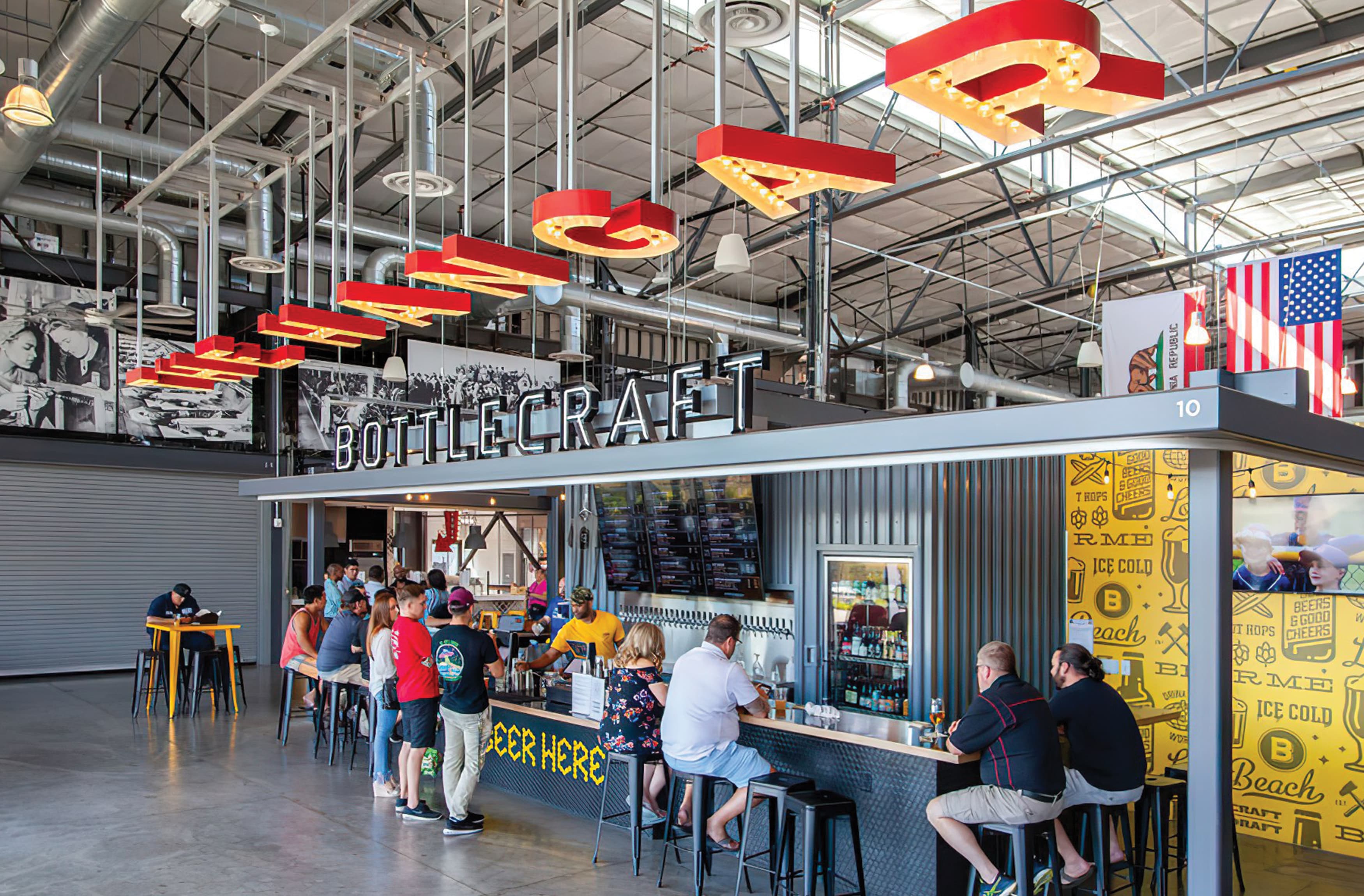 A photograph of signage inside The Hangar, a foodhall located at The Long Beach Exchange