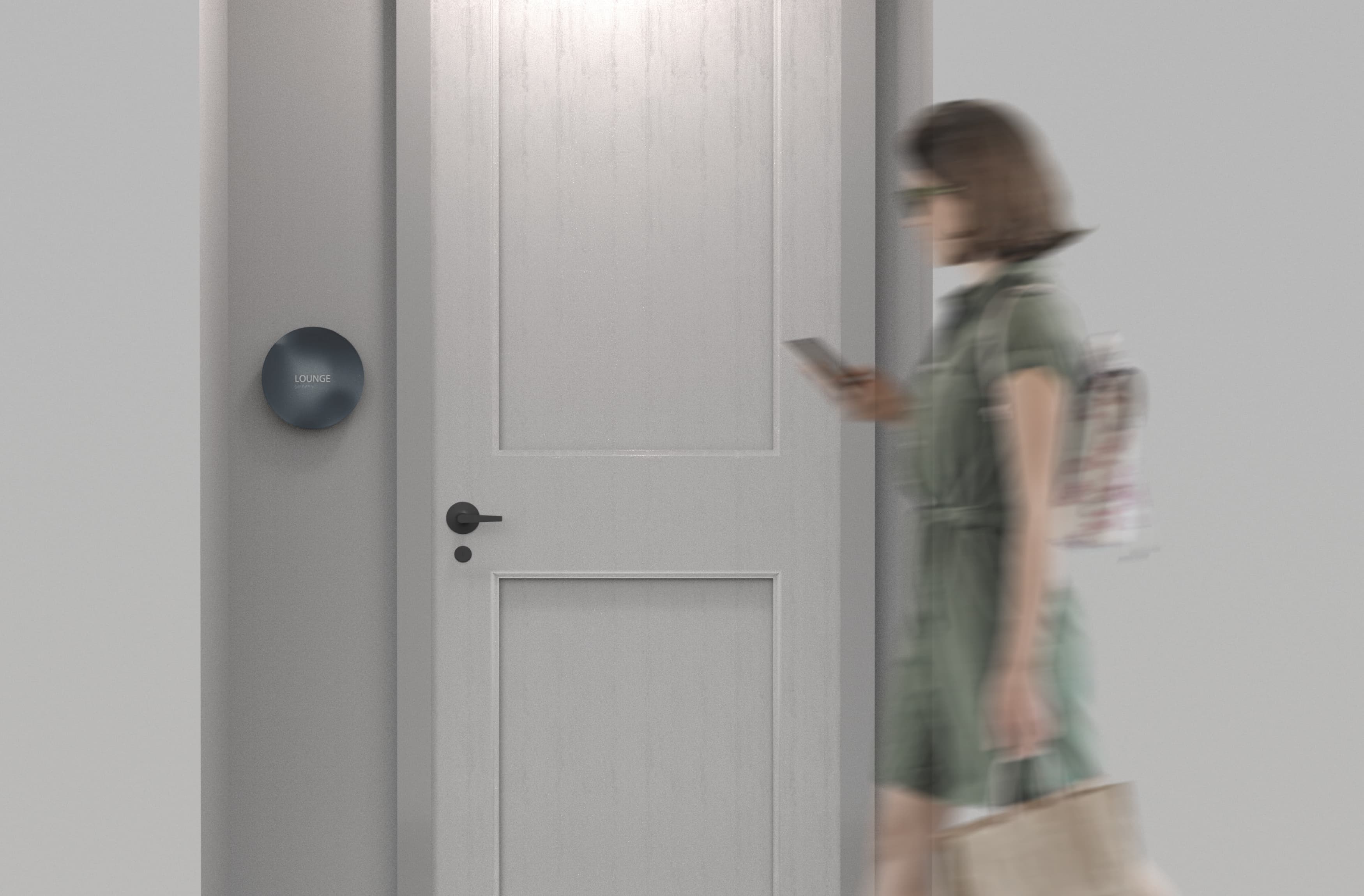 Image of a women walking past the Overland & Ayers signage in the hallway, designed by RSM Design. 