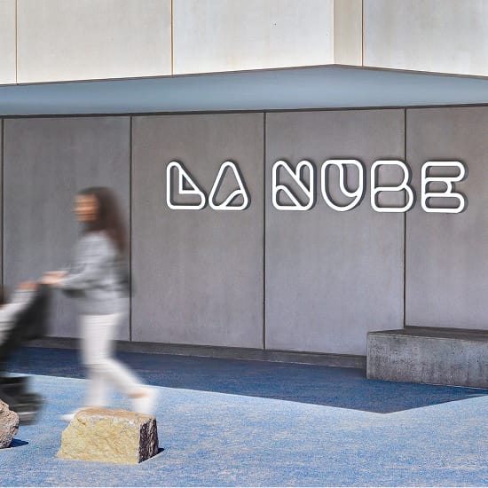 La Nube children's museum interior neon identity sign with custom letterforms — environmental graphic design by RSM Design