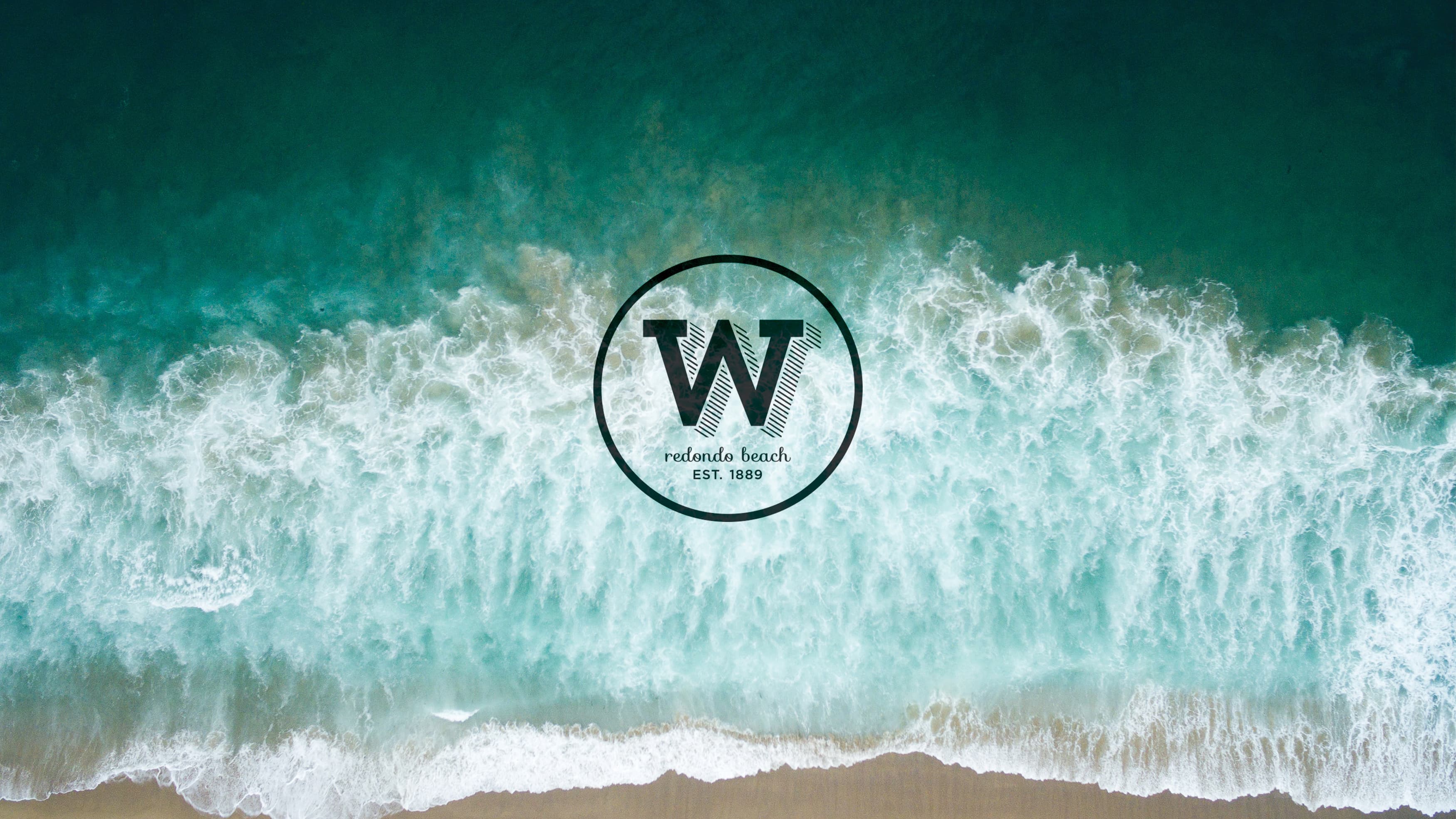 The waterftont branding prepared by RSM Design over image of the waves.