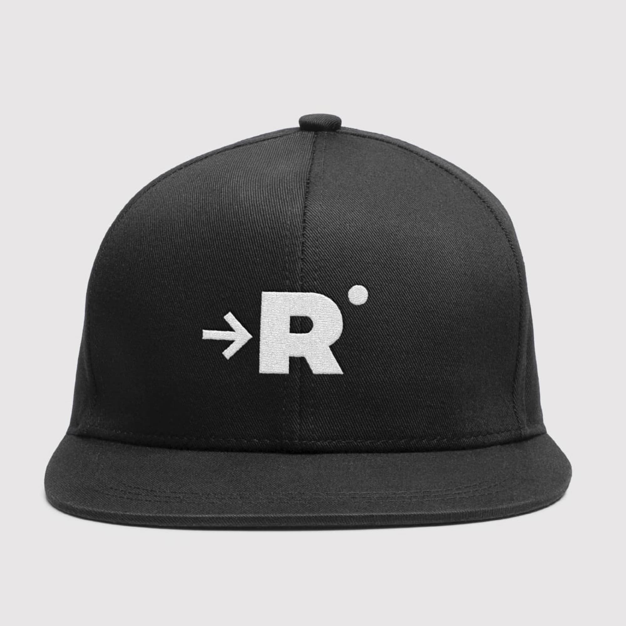 Black flat-brim snapback cap with a white embroidered logo of an arrow pointing into a capital 'R' with a small dot, on a light gray background.