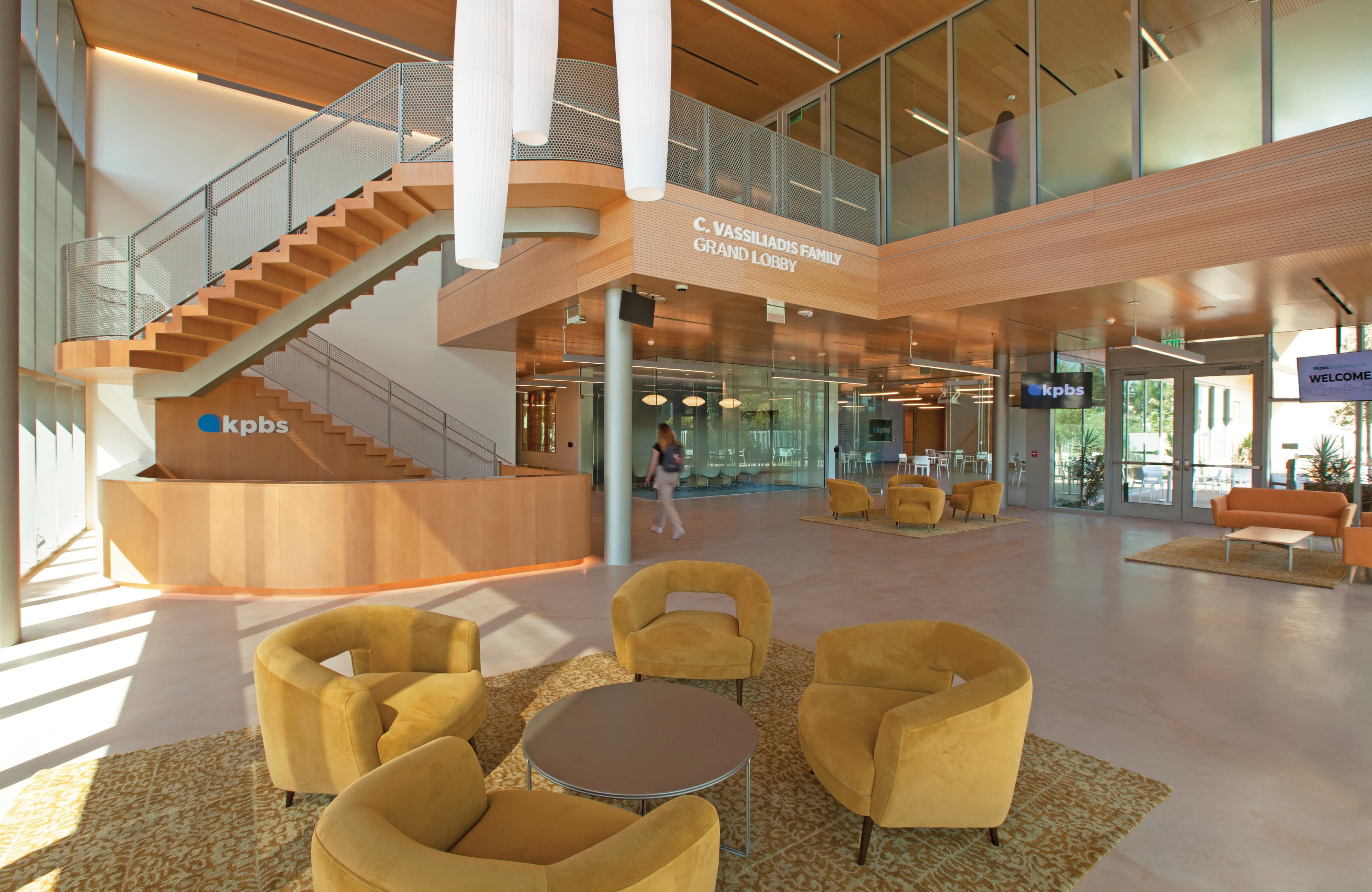 Interior of the KPBS Conrad Prebys Media Complex grand lobby featuring integrated environmental graphic design, branded signage, and intuitive wayfinding within a civic and education space, highlighting RSM Design expertise in placemaking, identity, and experiential design for institutional and cultural environments.