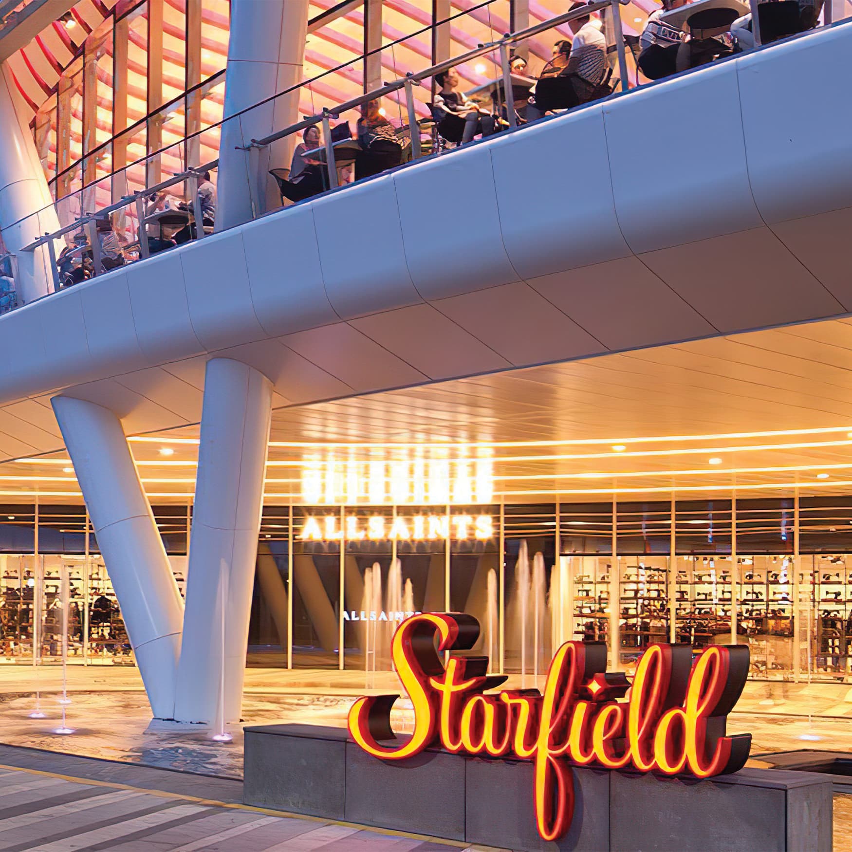 Shopping mall entrance with orange placemaking identity signage