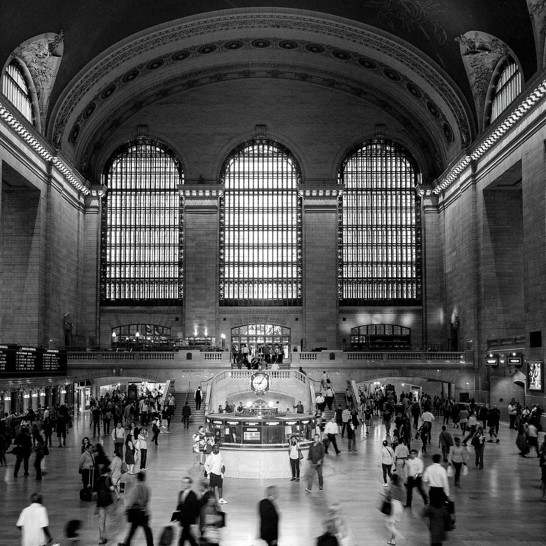 Black and white image of interior of Grand Central Terminal.