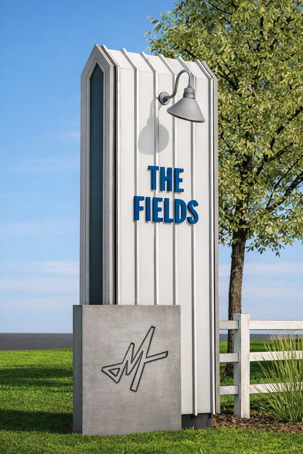 Architectural rendering of a tall vertical monument sign reading "The Fields" with blue dimensional lettering, a gooseneck barn light, and Mayfair brand icon on a concrete base beside a white fence and open landscape, showcasing wayfinding, signage design, and placemaking for a mixed-use residential community by RSM Design.