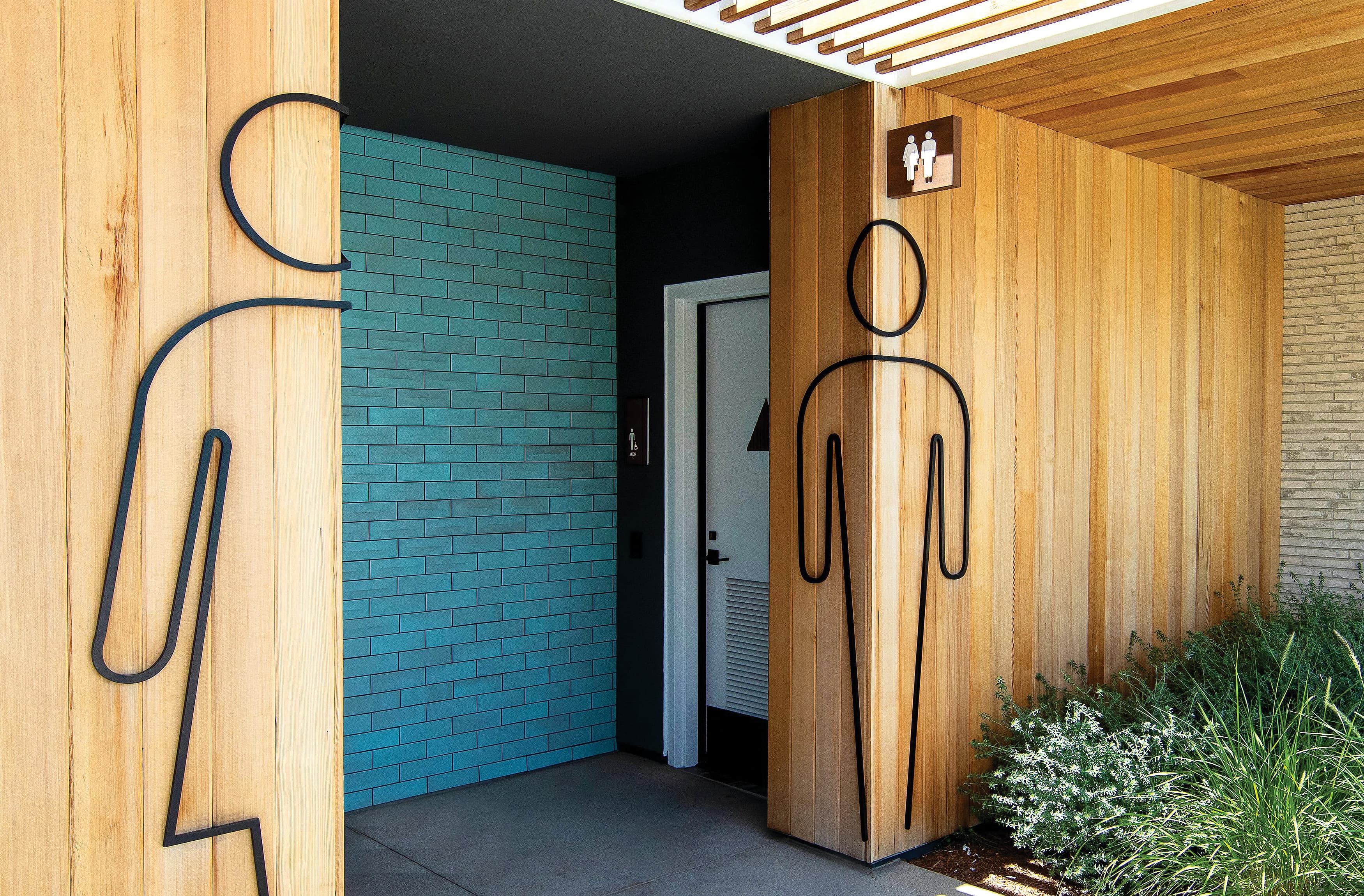 Wooden outlined restroom core identity at Rise Park in Irvine, California.