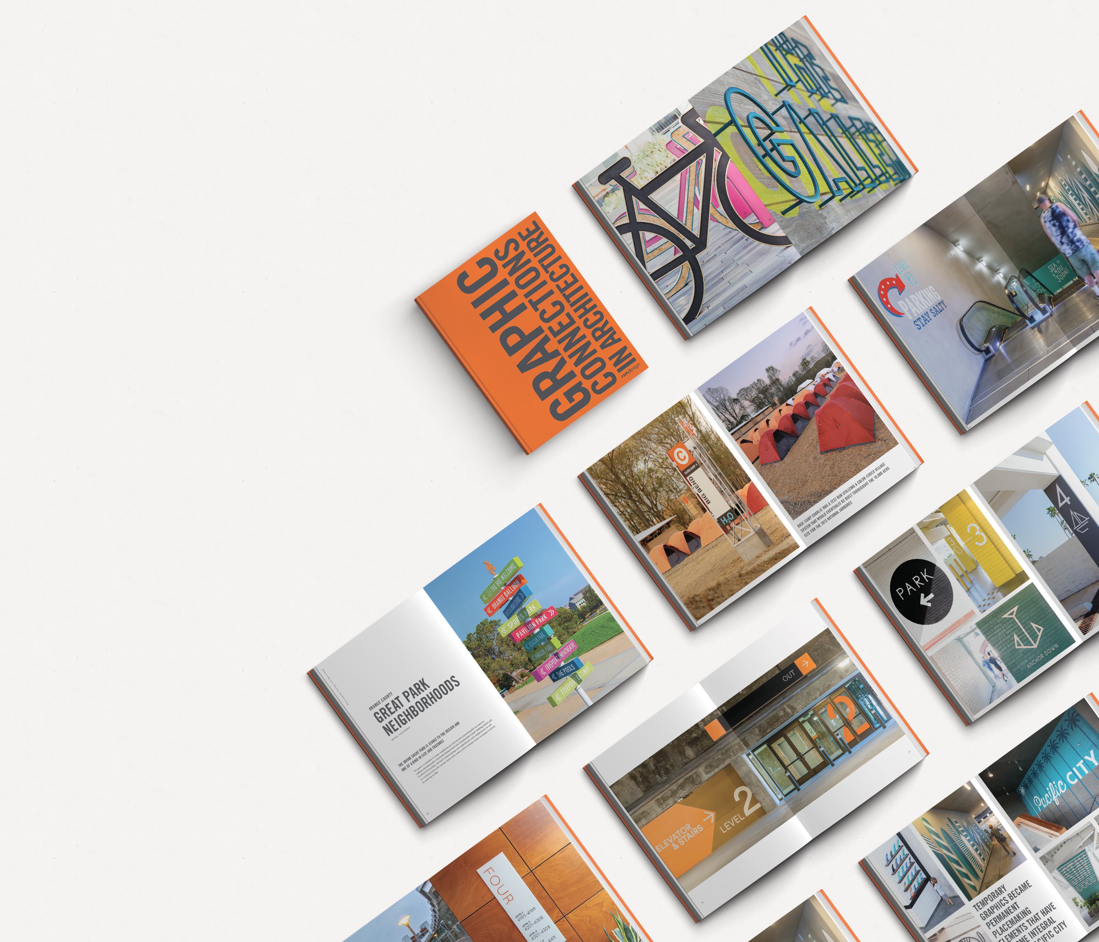An arrangement of RSM Design's newest book, Graphic Connections in Architecture, displays several pages from the book.
