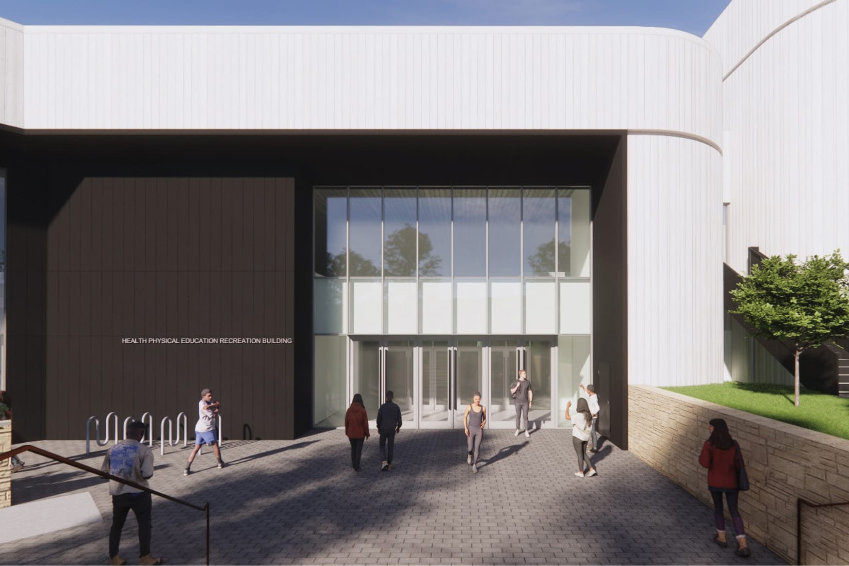 Architectural rendering of the exterior entrance to the Health Physical Education Recreation Building. The modern facade features dark panels, a two-story glass curtain wall entry, and multiple glass doors. Several people walk toward and around the entrance on a brick plaza. Bike racks are visible to the left, and trees and a stone retaining wall are seen on the right.
