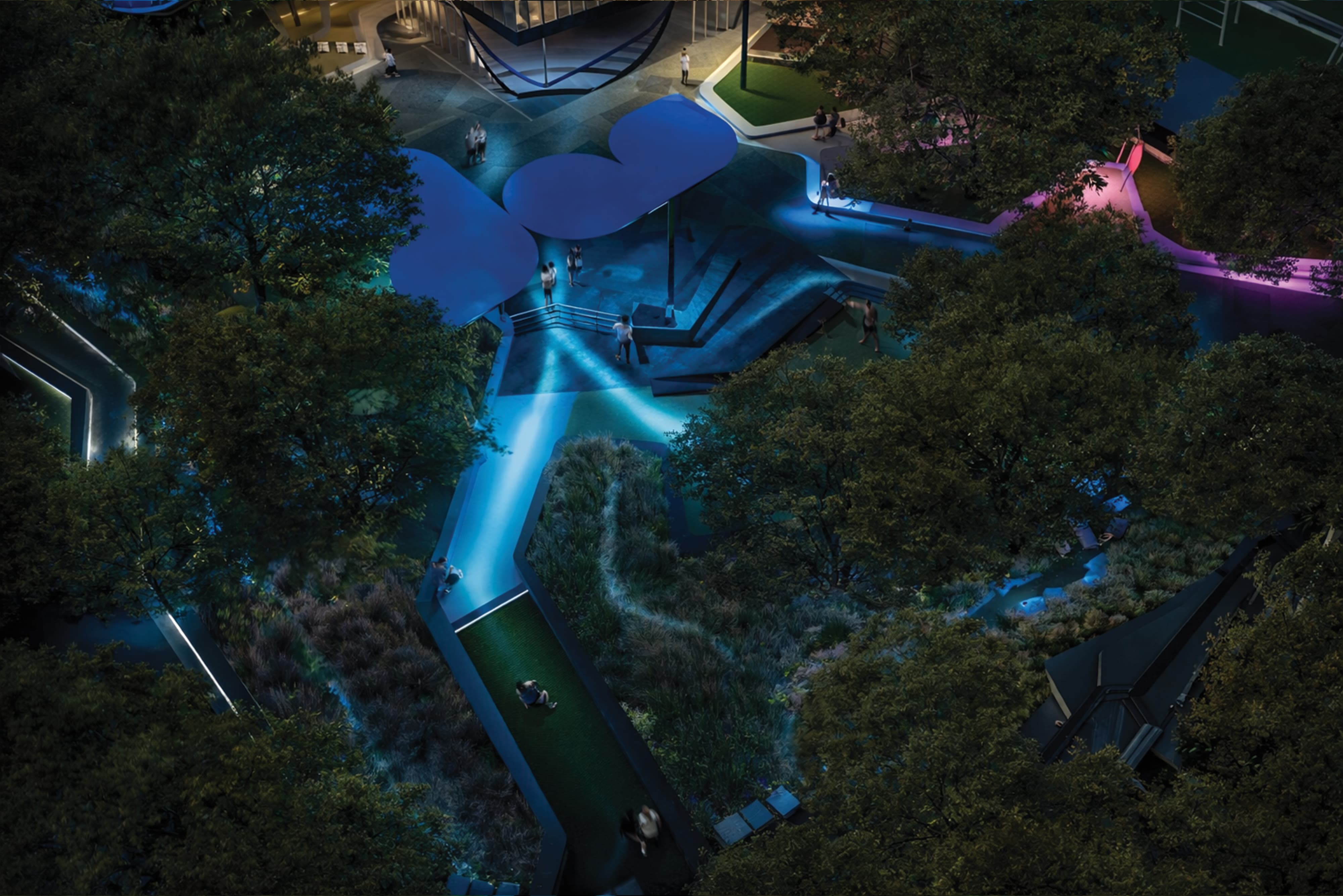 Aerial night rendering of Grand Park Los Angeles illuminated pedestrian promenade and gathering spaces with blue and pink experiential lighting, sculptural canopy shade structure, activated pathways through mature tree canopy, and integrated light graphic ground treatments — RSM Design art programs, public art, experiential placemaking, specialty graphics, digital integration, and environmental graphic design for civic, park, cultural, and streetscape destinations.