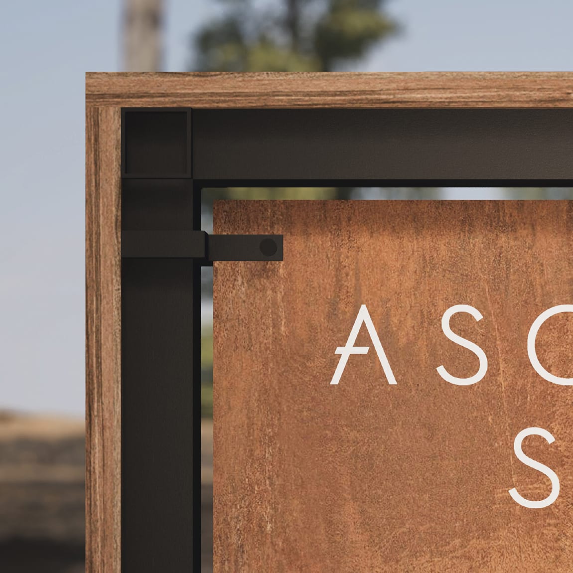Close-up detail of the Ascent Spa sign at Tenaya at Yosemite, showing the wood and blackened steel frame construction
