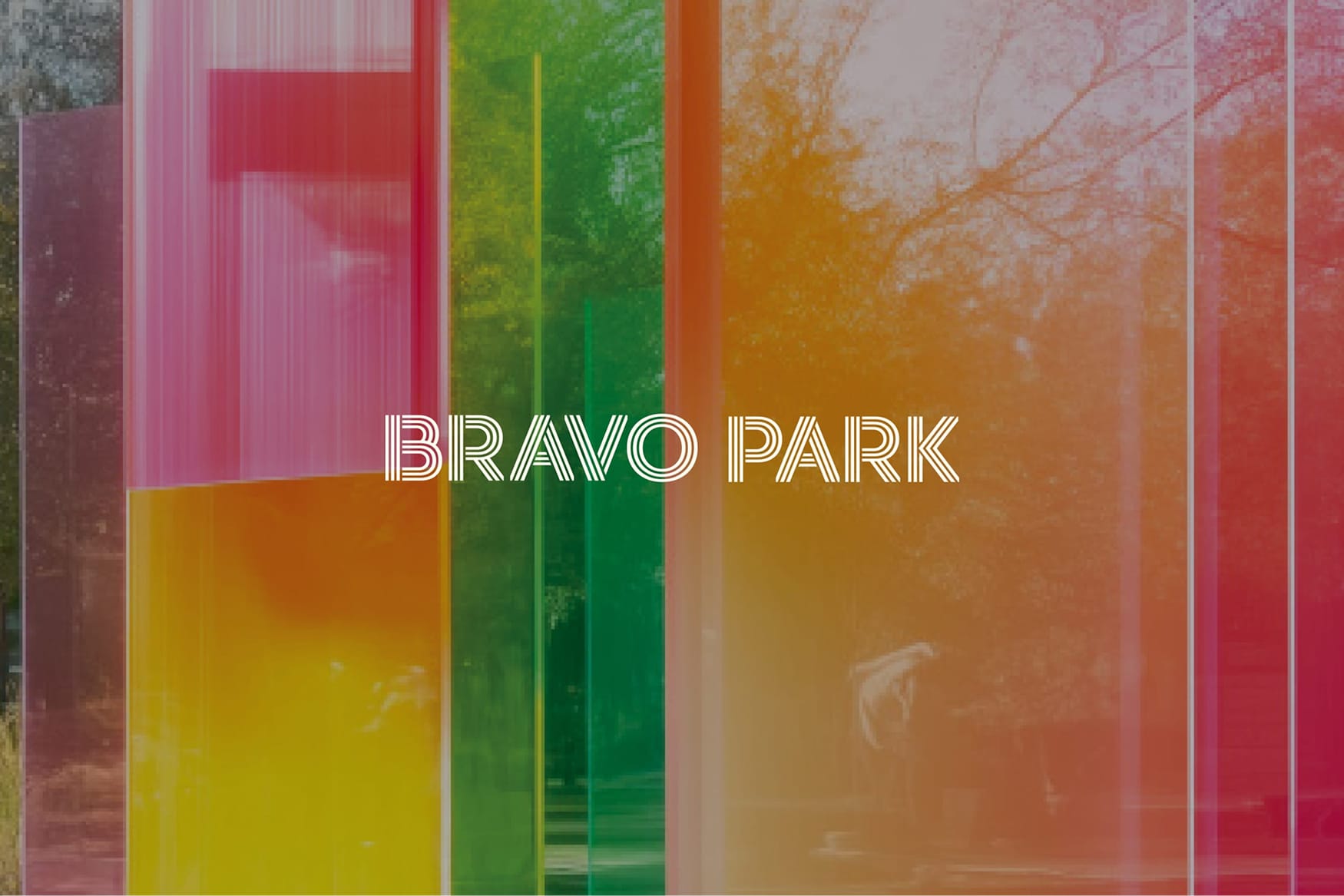 RSM Design Bravo Park — project title graphic overlaid on colourful translucent panel art installation with park trees visible through layered rainbow-toned acrylic screens