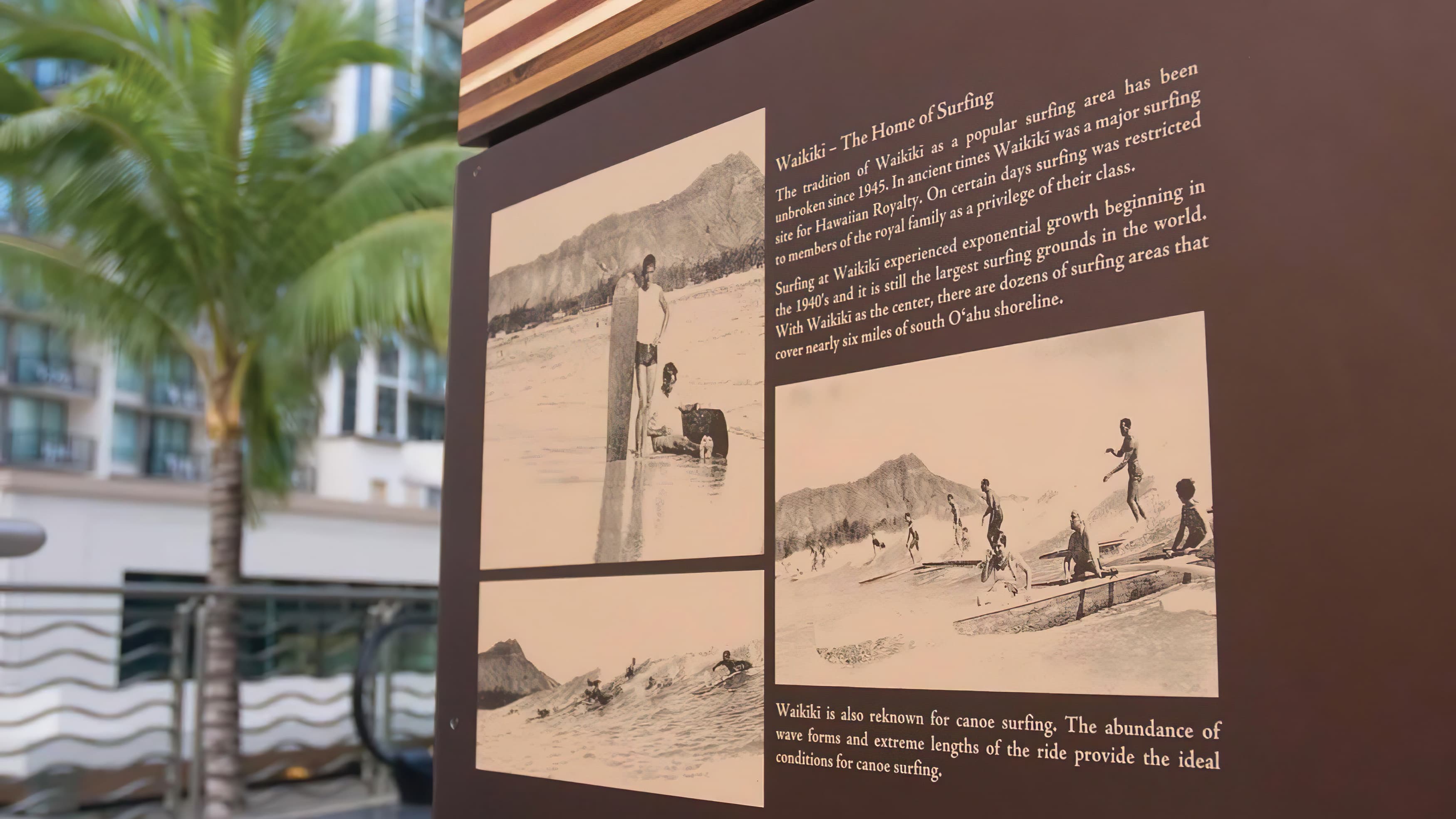 A close-up photo of an interpretive sign panel located in downtown Waikiki.