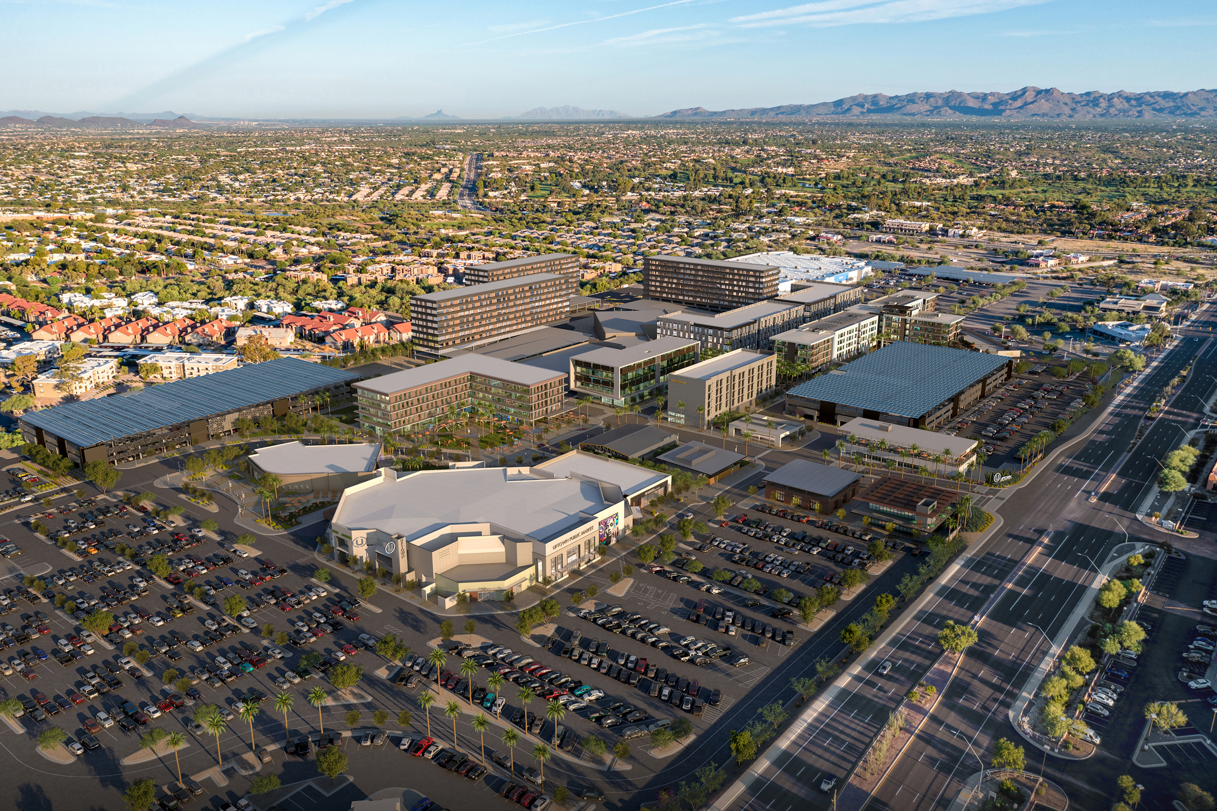 Aerial rendering of Uptown Tucson mixed-use development with retail, office buildings, and parking against a desert mountain backdrop, placemaking by RSM Design