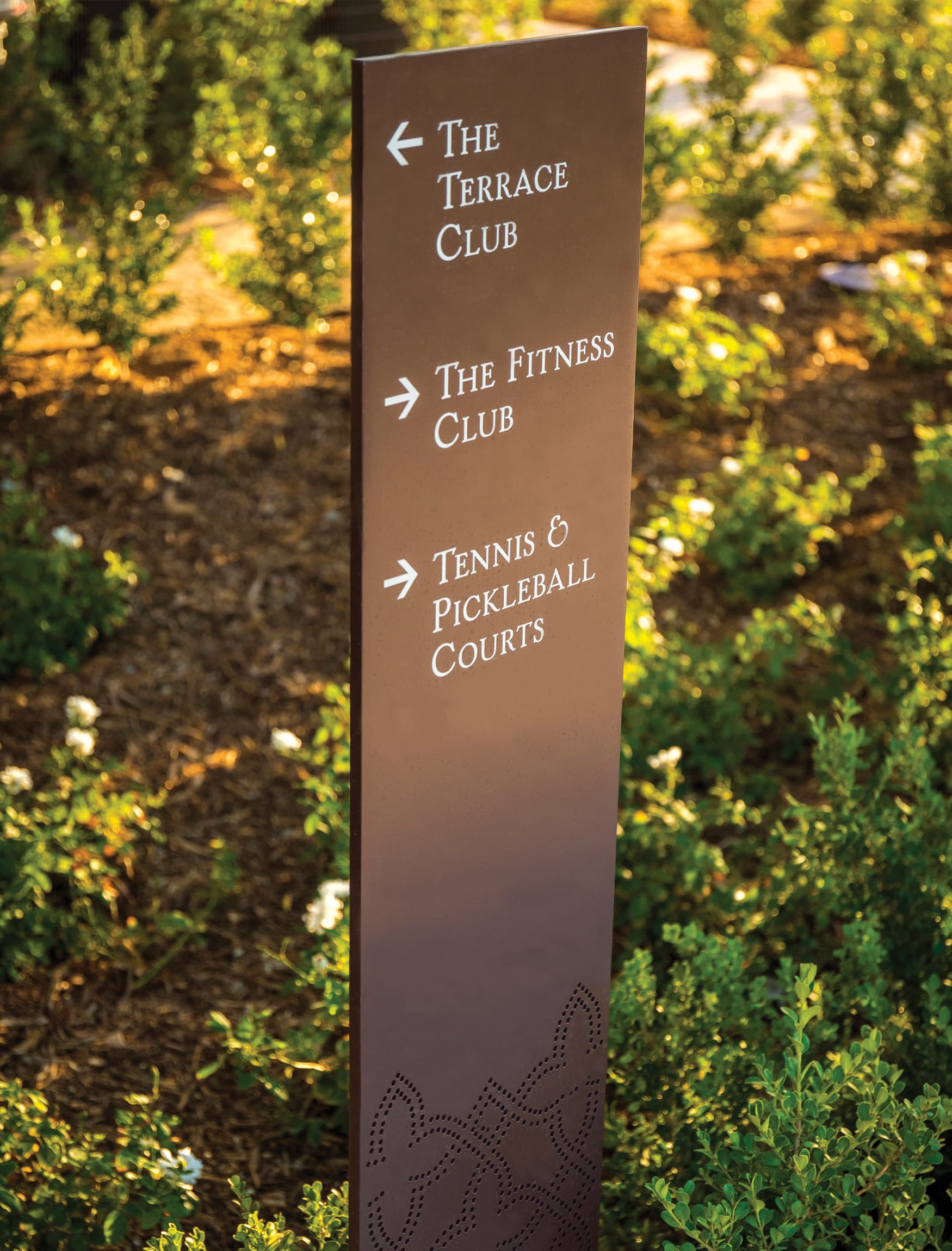 Terramor, a residential community in Corona, California. RSM Design. Stacked Stone Landscape Wall with Project Identity. Residential Placemaking Gateway. Residential Wayfinding Design. Trail Signage.