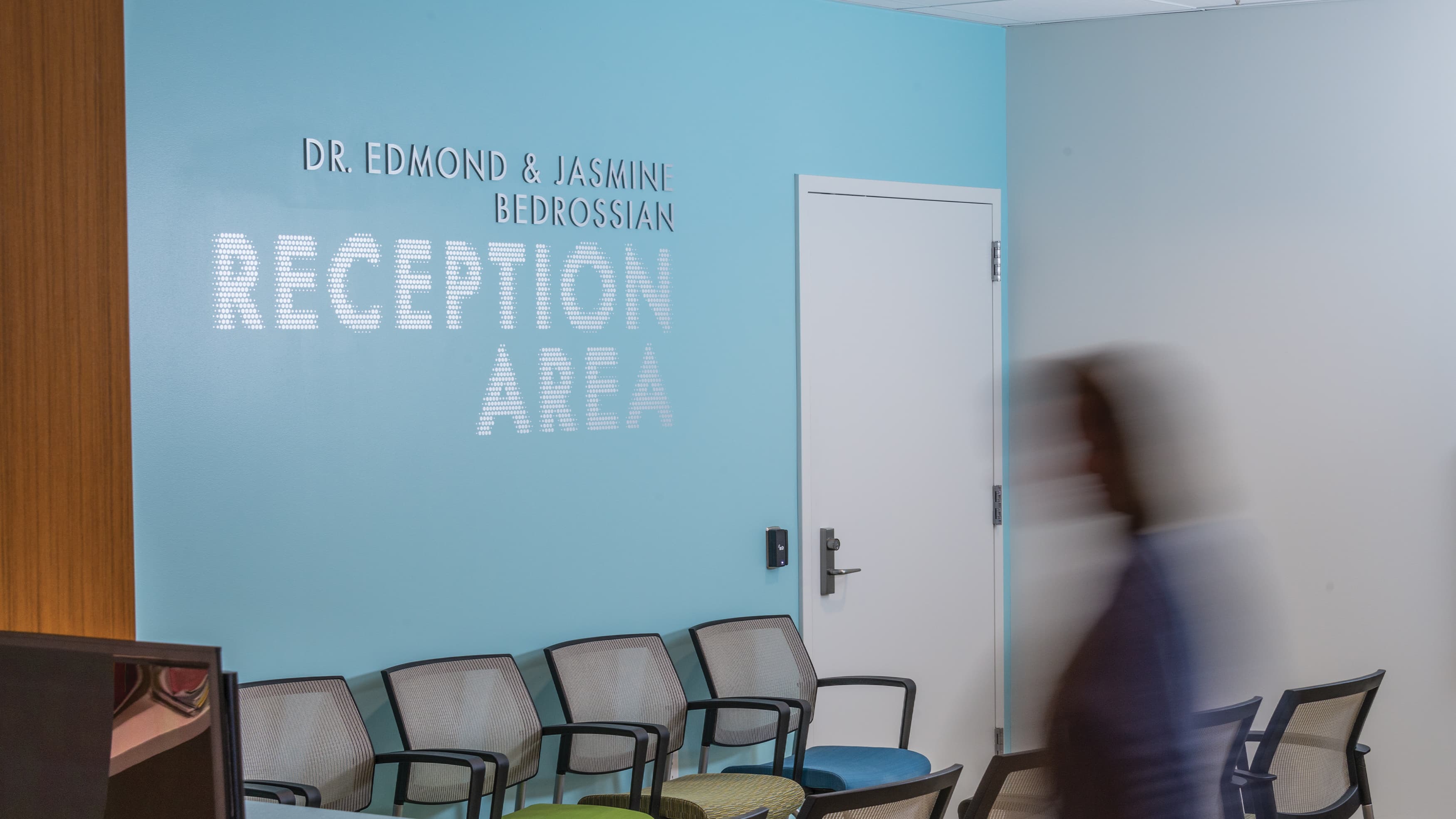A photograph of wall signage in the reception area at the University of the Pacific Dental Care Center in San Francisco, CA.