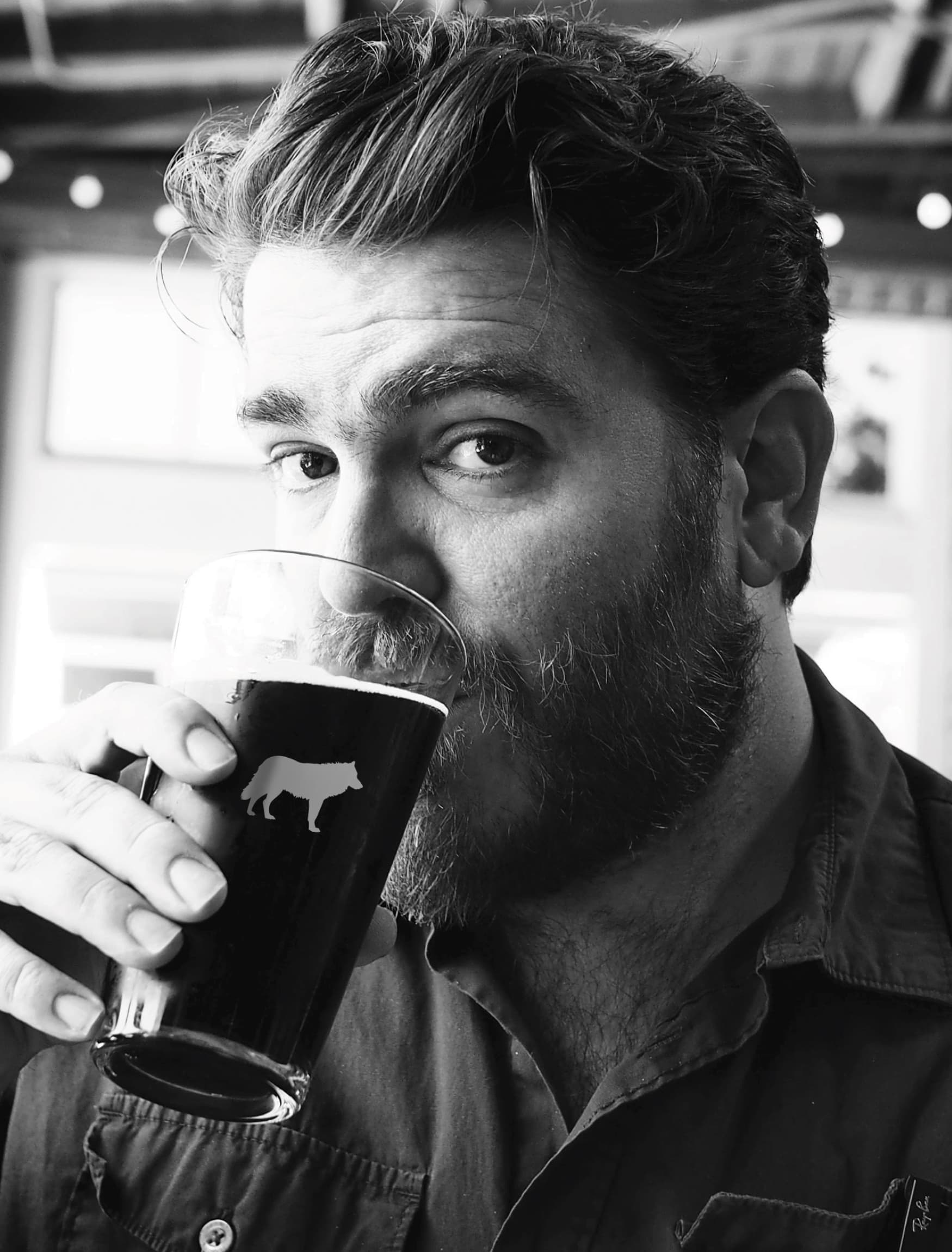 Image of a man drinking beer at Jack London Square. 