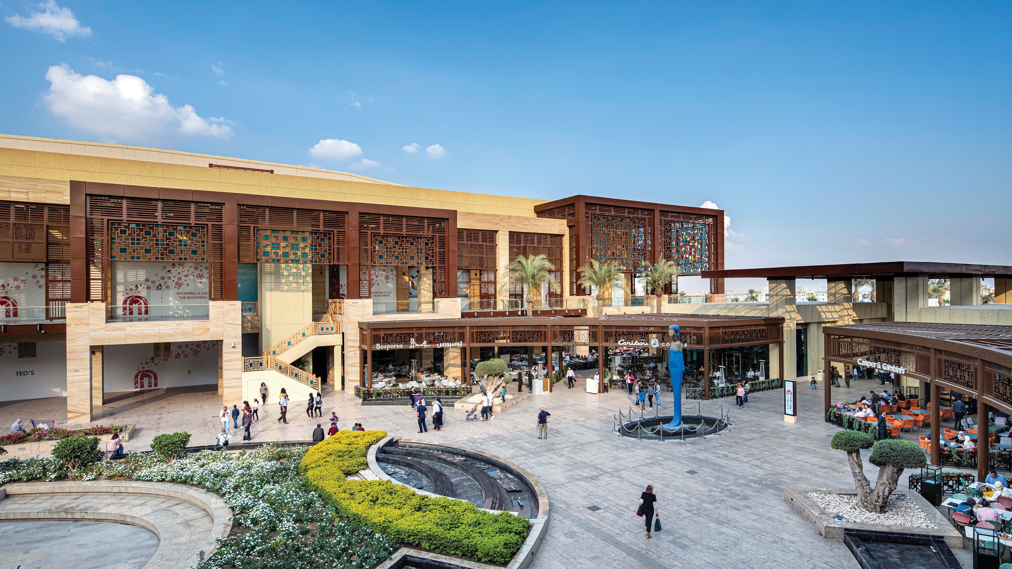 Overhead view of Mall of Egypt's outdoor retail center with monument sign