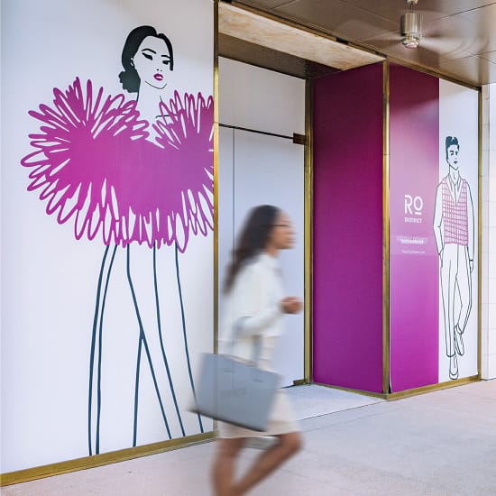 River Oaks District Houston illustrated wall graphics in magenta at building entrance, environmental graphic design by RSM Design