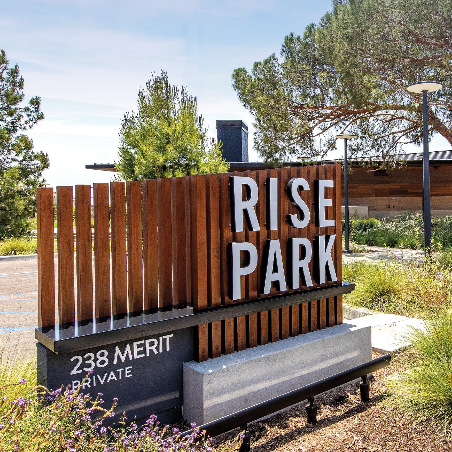 Wooden entrance sign for Rise Park in Irvine, California.