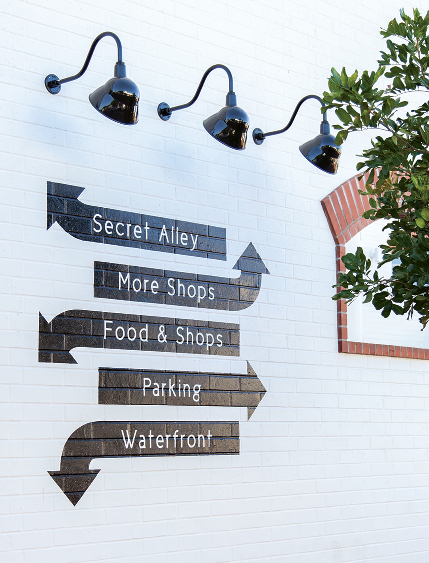 Image of a painted directional wayfinding piece at Lido Marina Village, designed by RSM Design. 