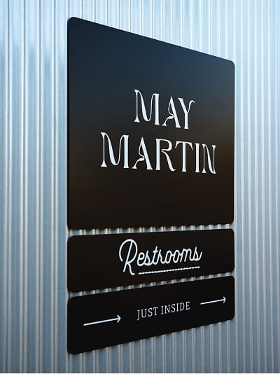 River Street Marketplace May Martin storefront and restroom signage, wayfinding design by RSM Design