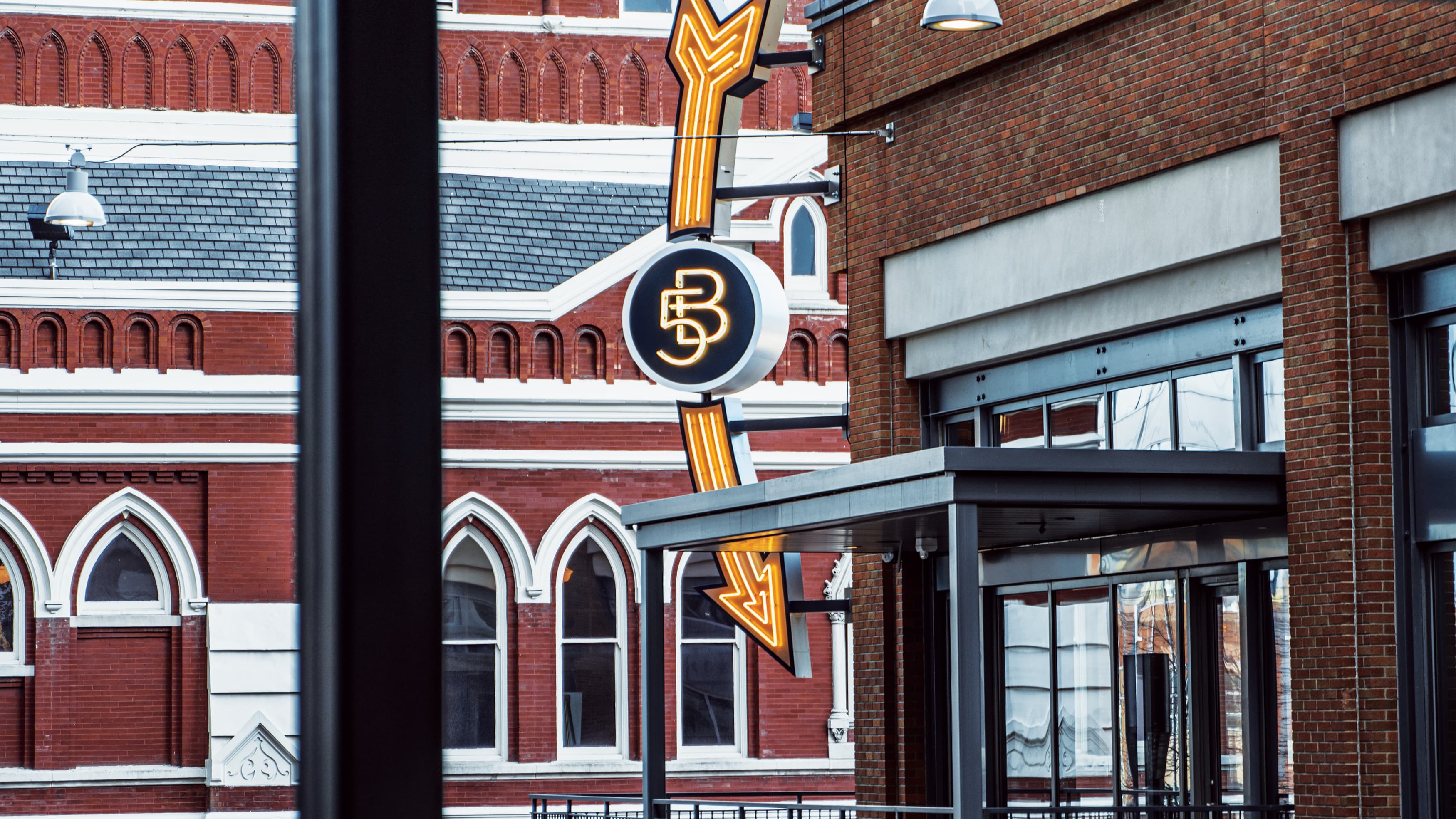 A detailed view of the Fifth and Broadway project identity sign