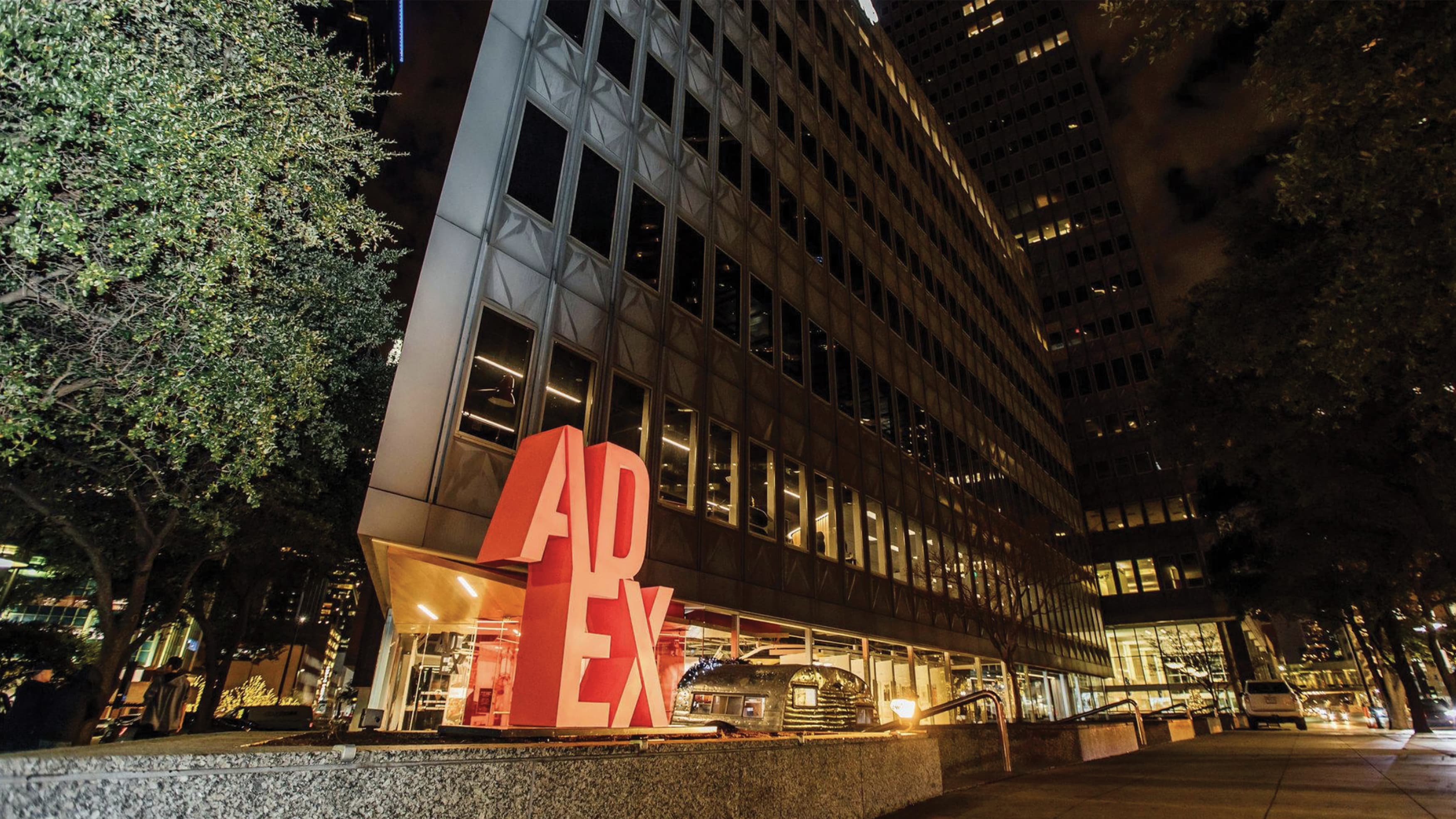 Exterior monument signage and streetscape outside Ad Ex building in downtown Dallas