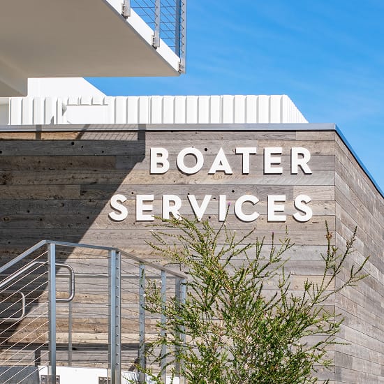 Dana Point Harbor Boater Services building-mounted dimensional lettering on reclaimed wood facade — environmental graphic design by RSM Design